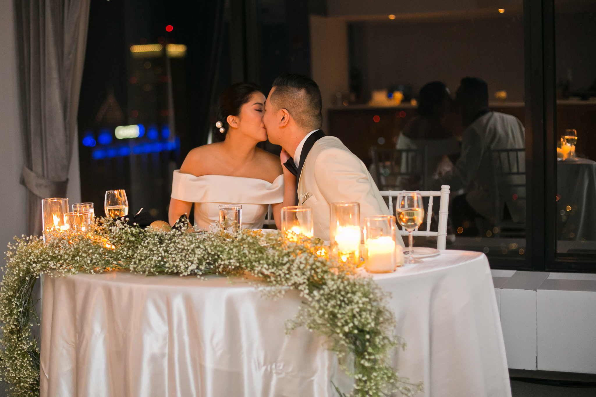 Married couple kissing social club wedding