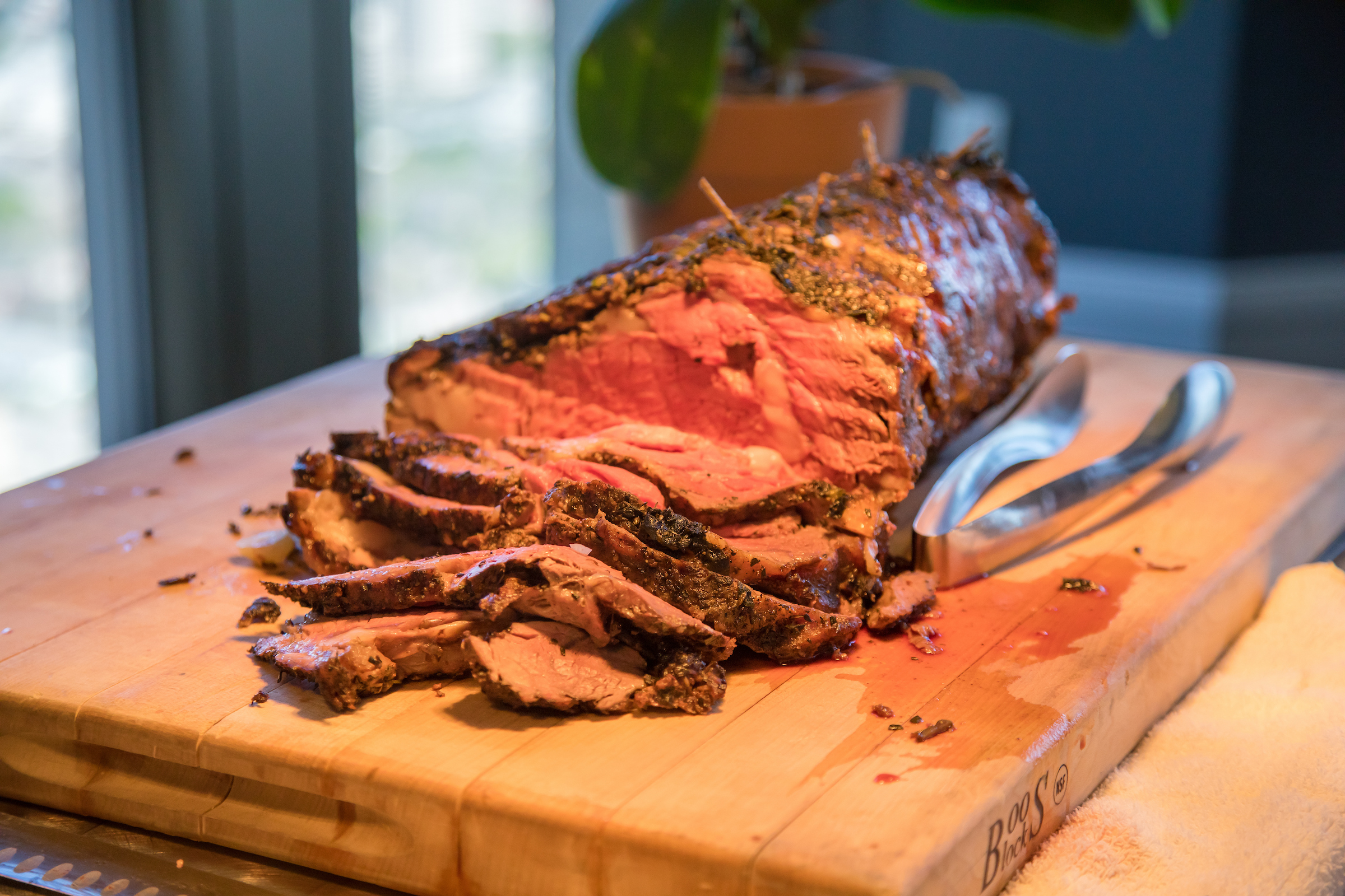 Sliced Prime Rib on a wooden cutting board