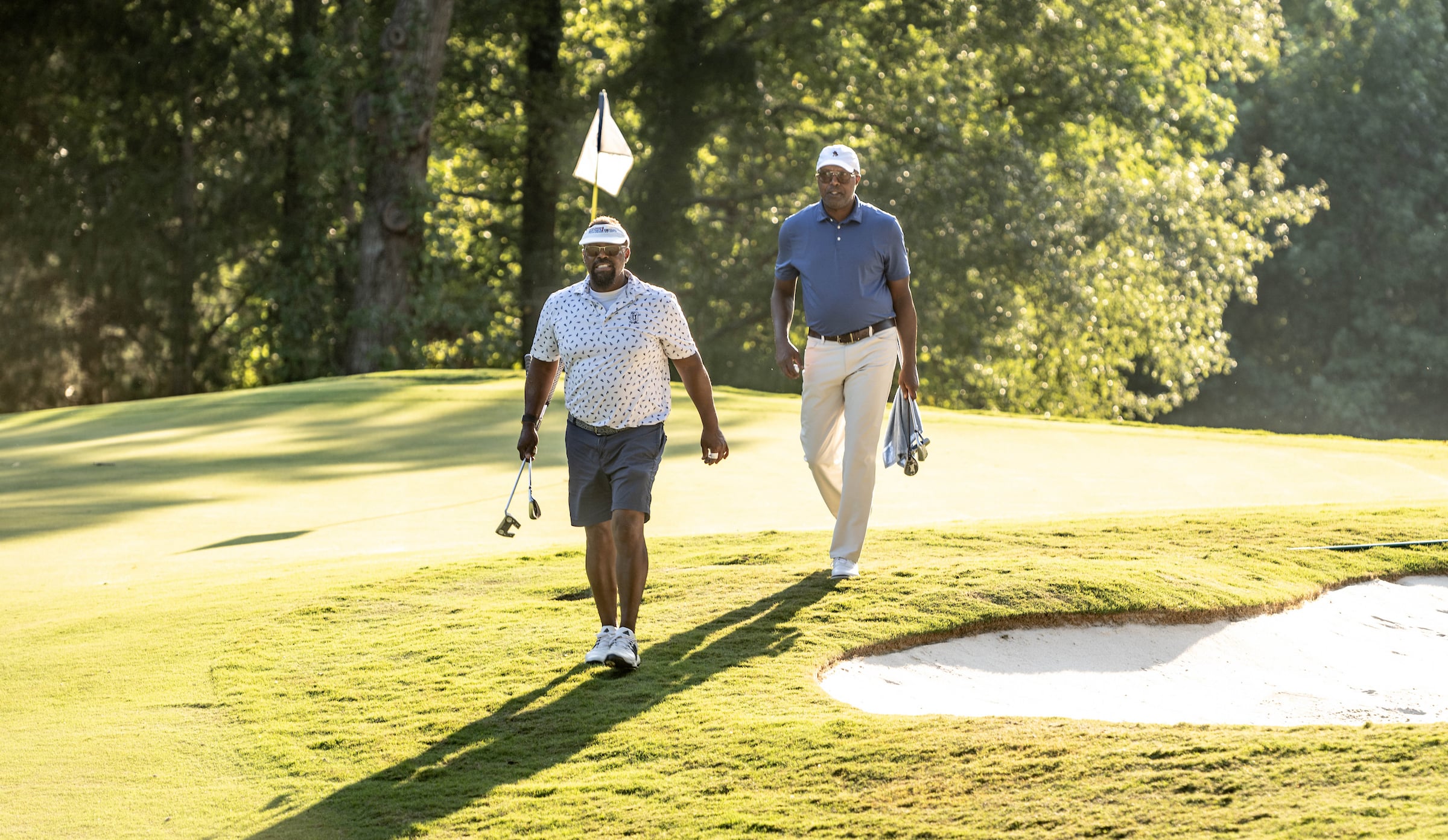 Men walking off a green
