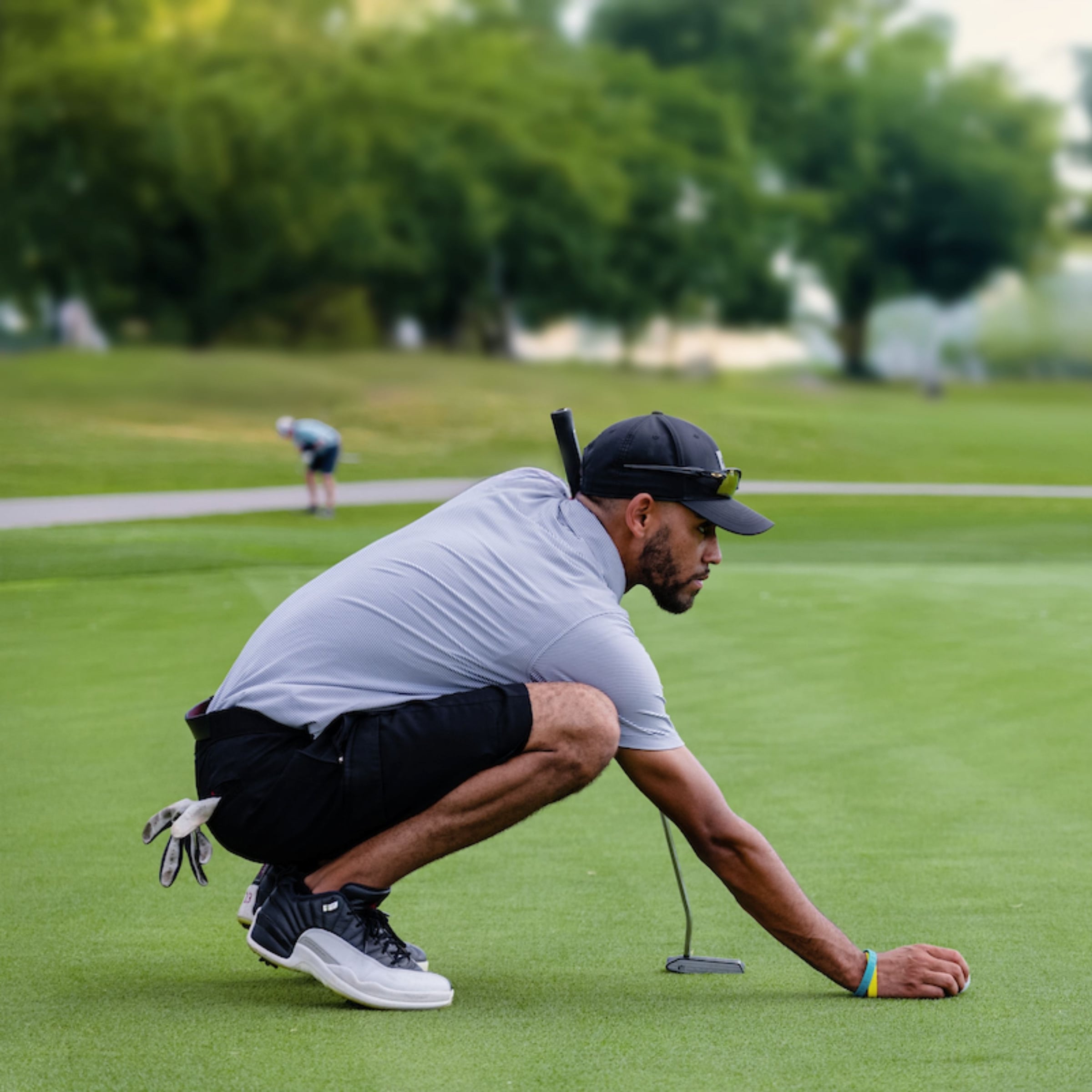 Golfer lining up putt