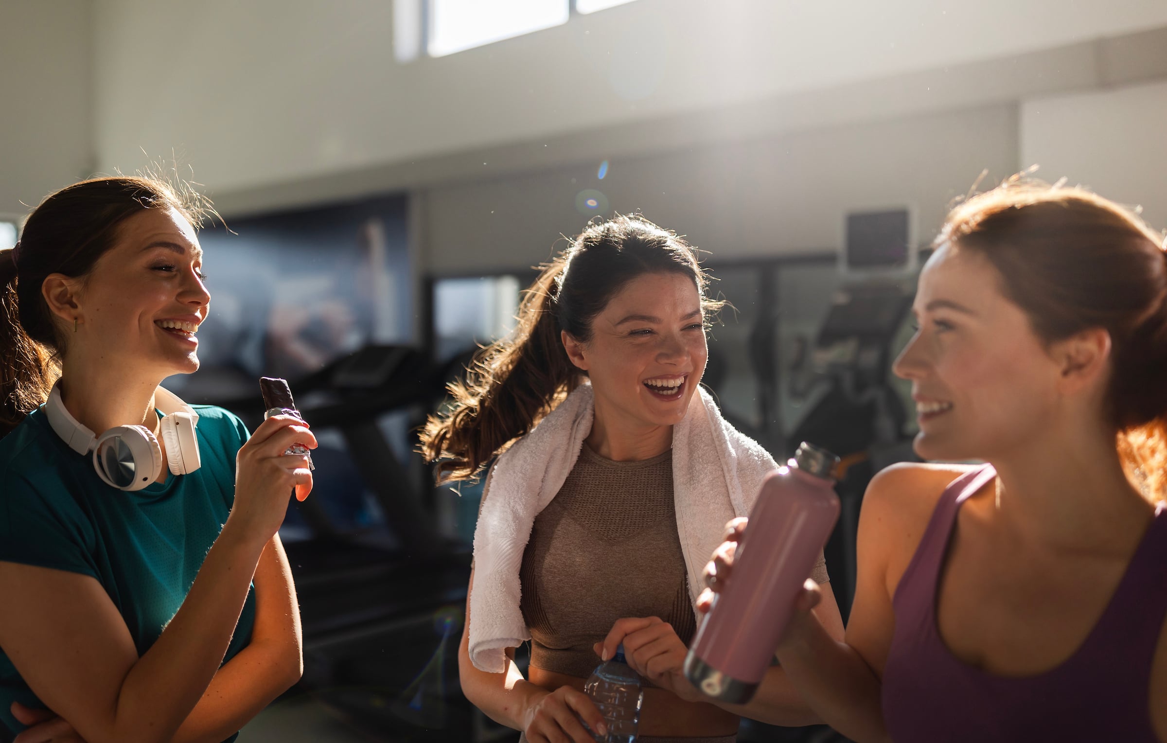 3 young women talking together after their workout