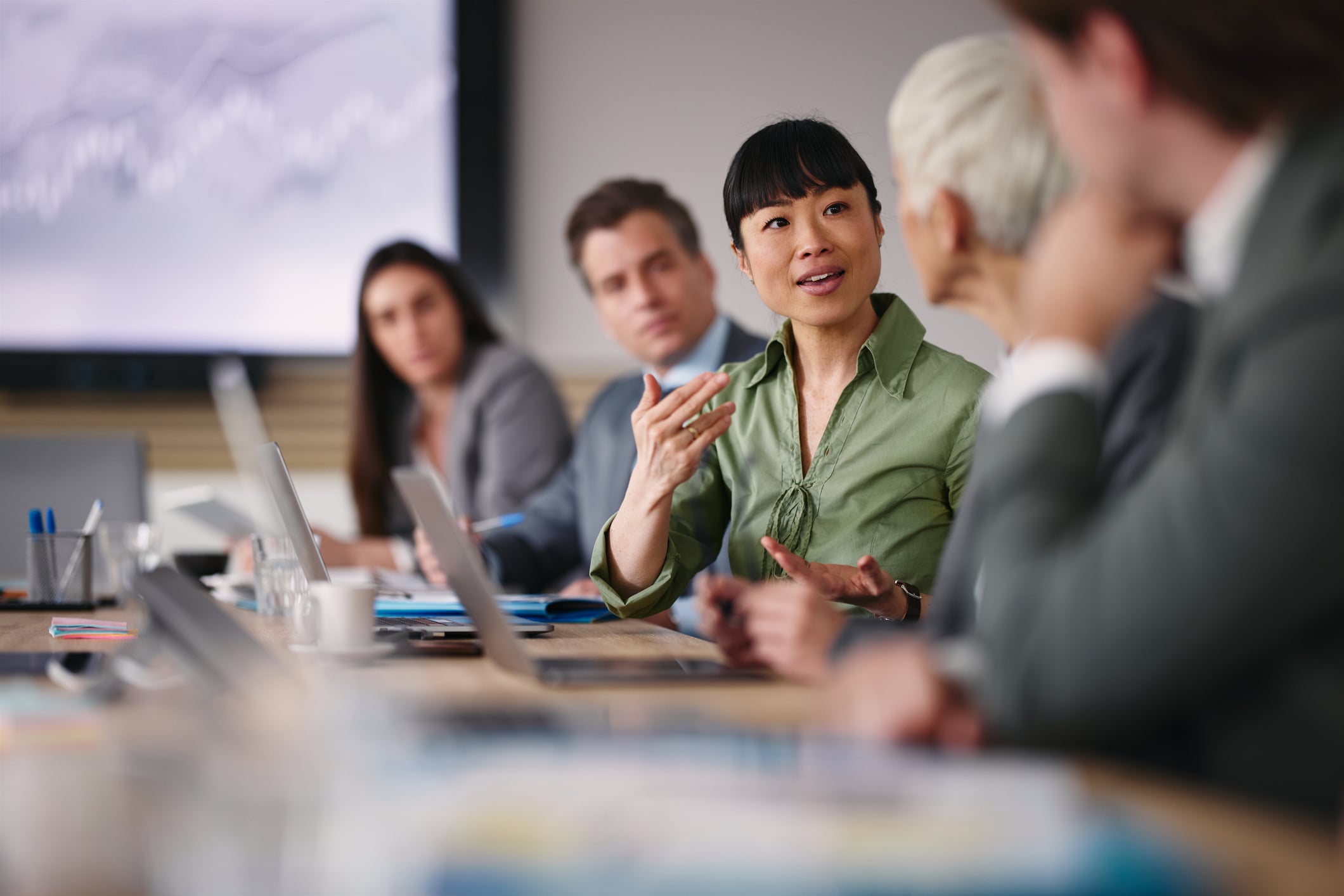 Men & Women at a meeting table