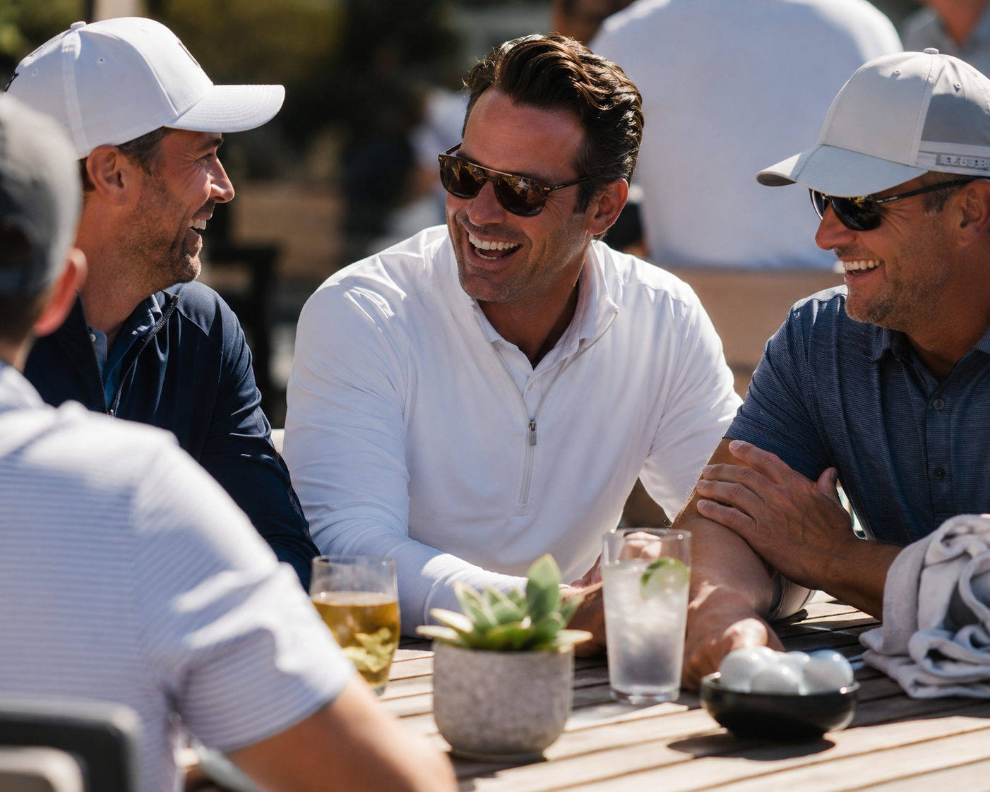 4 older men enjoying a meal after golf