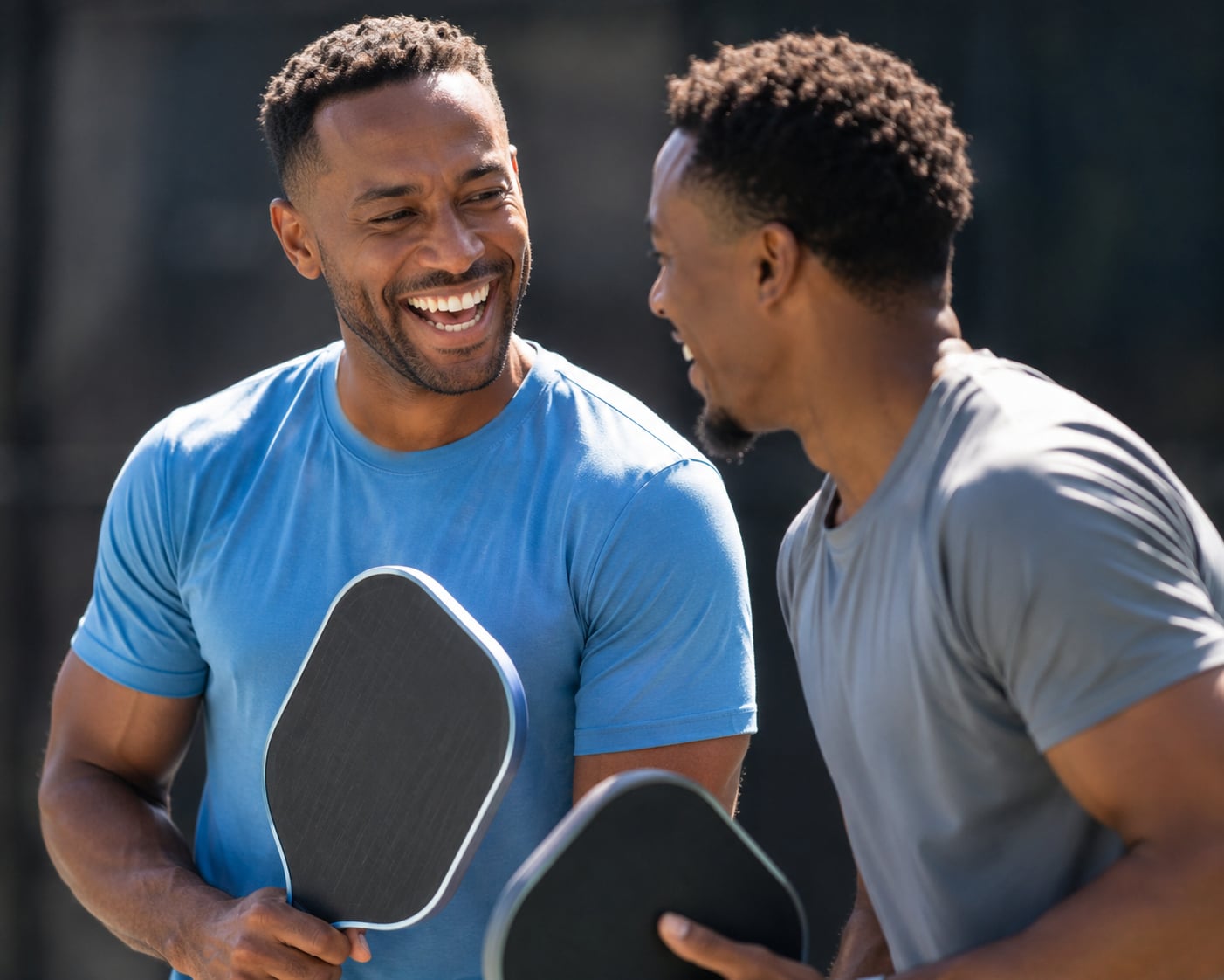 Two men playing pickleball