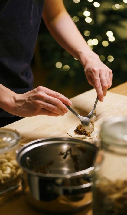 Hands holding spoons