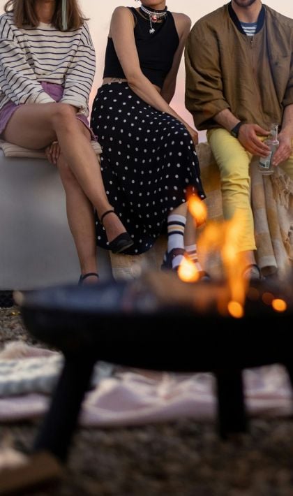 People by a fire pit