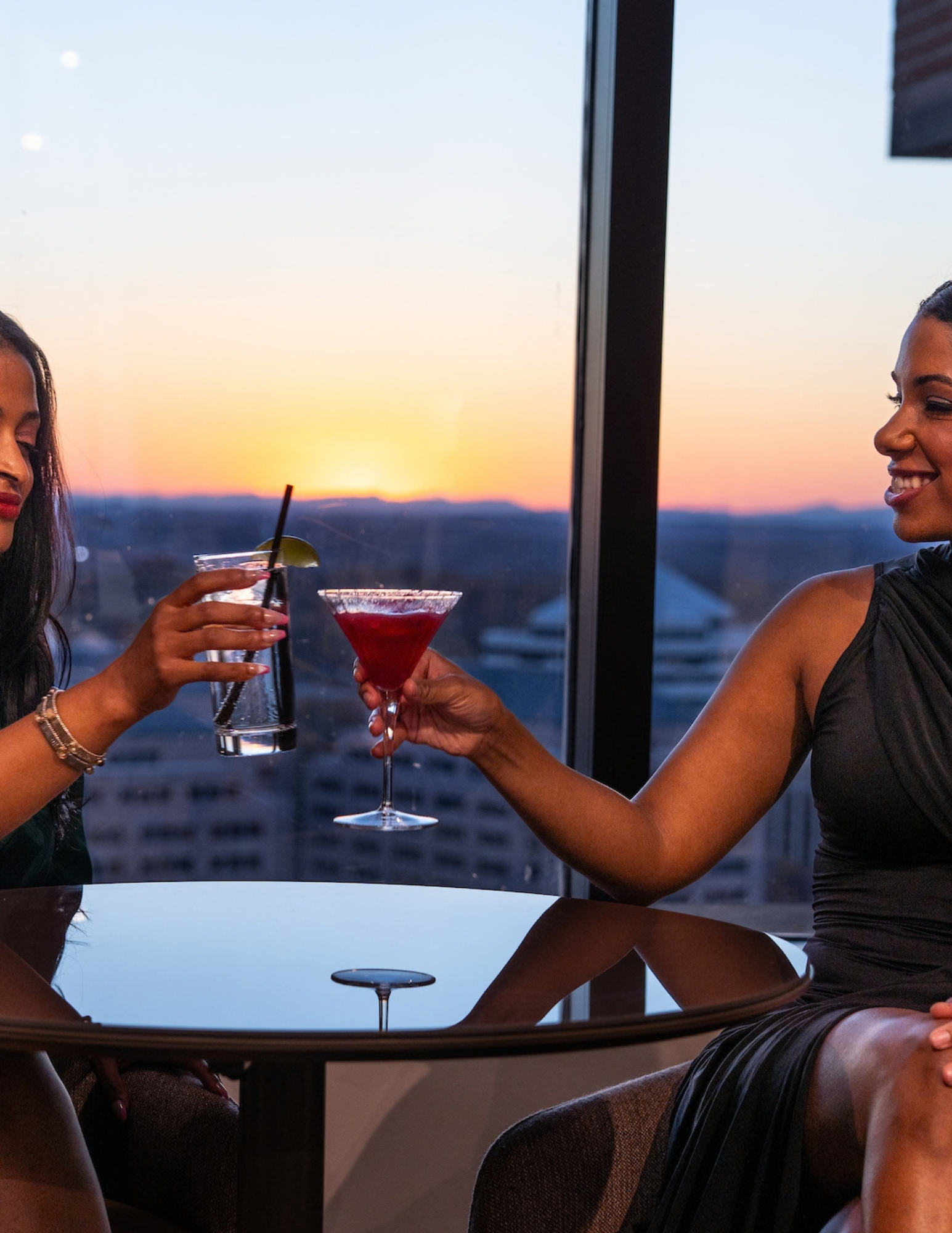 Members toasting at sunset