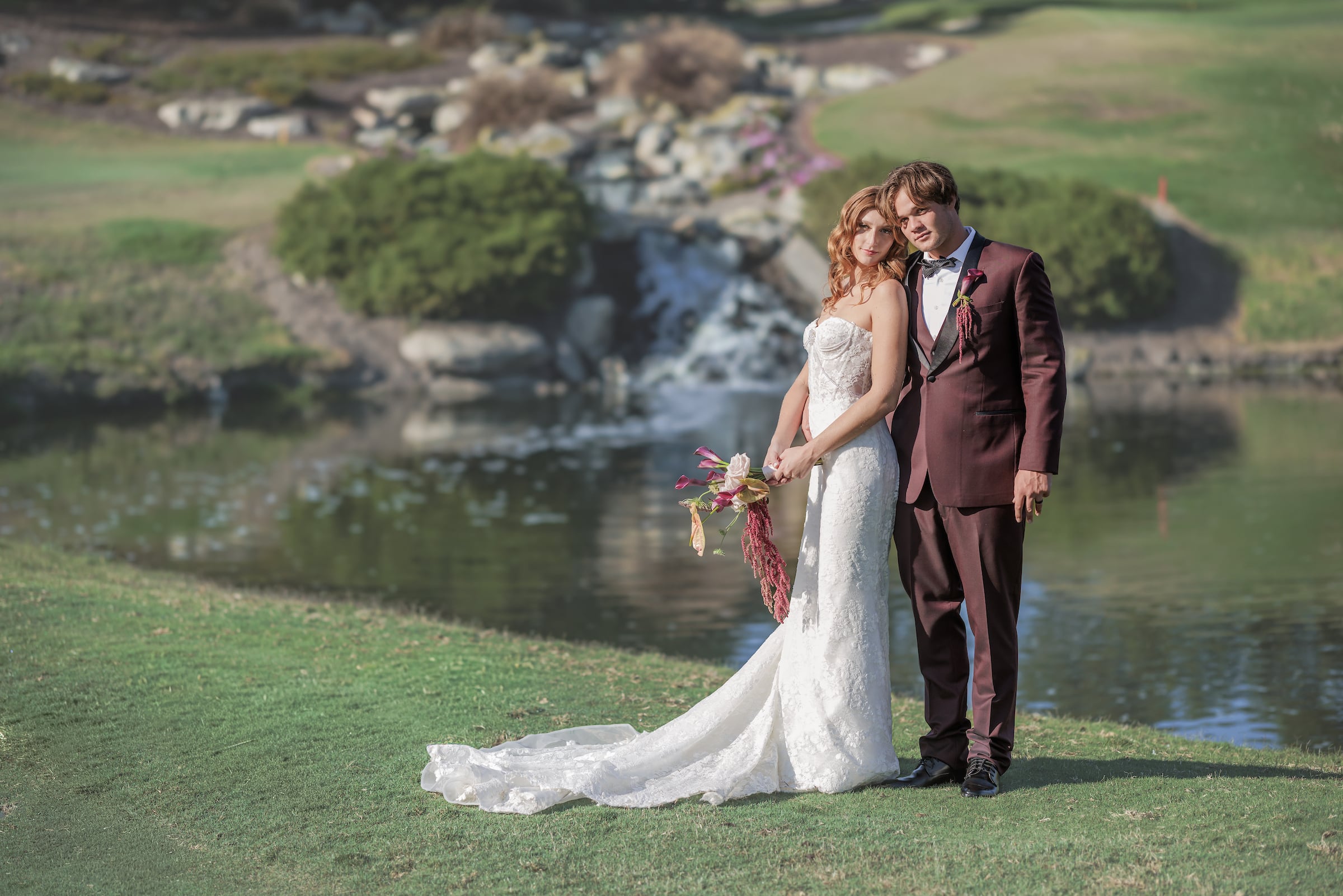 Bride & Groom posing for picture on golf course