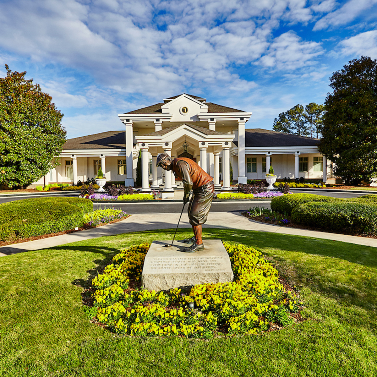 Bronze statue of golfer putting
