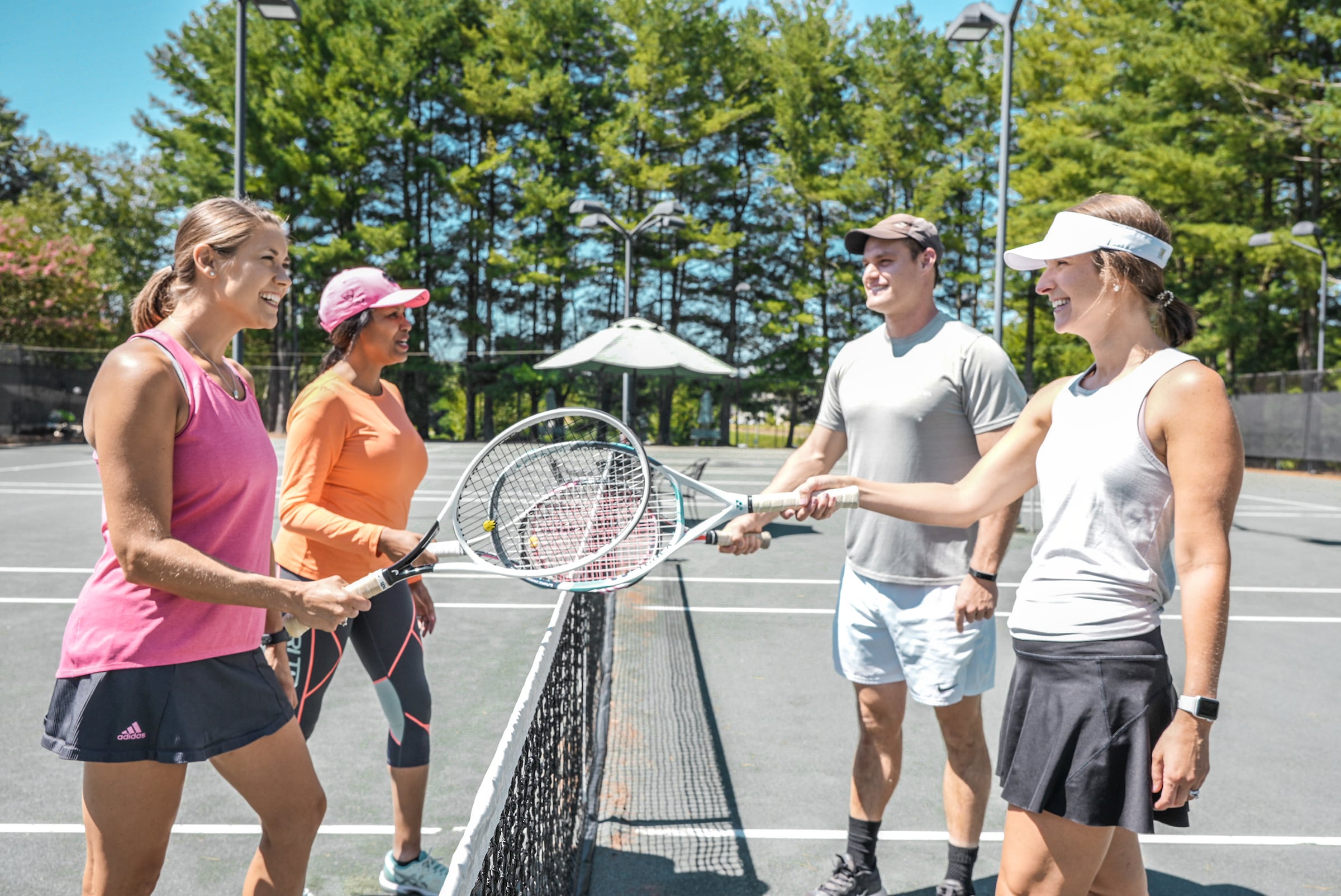 4 tennis players on court