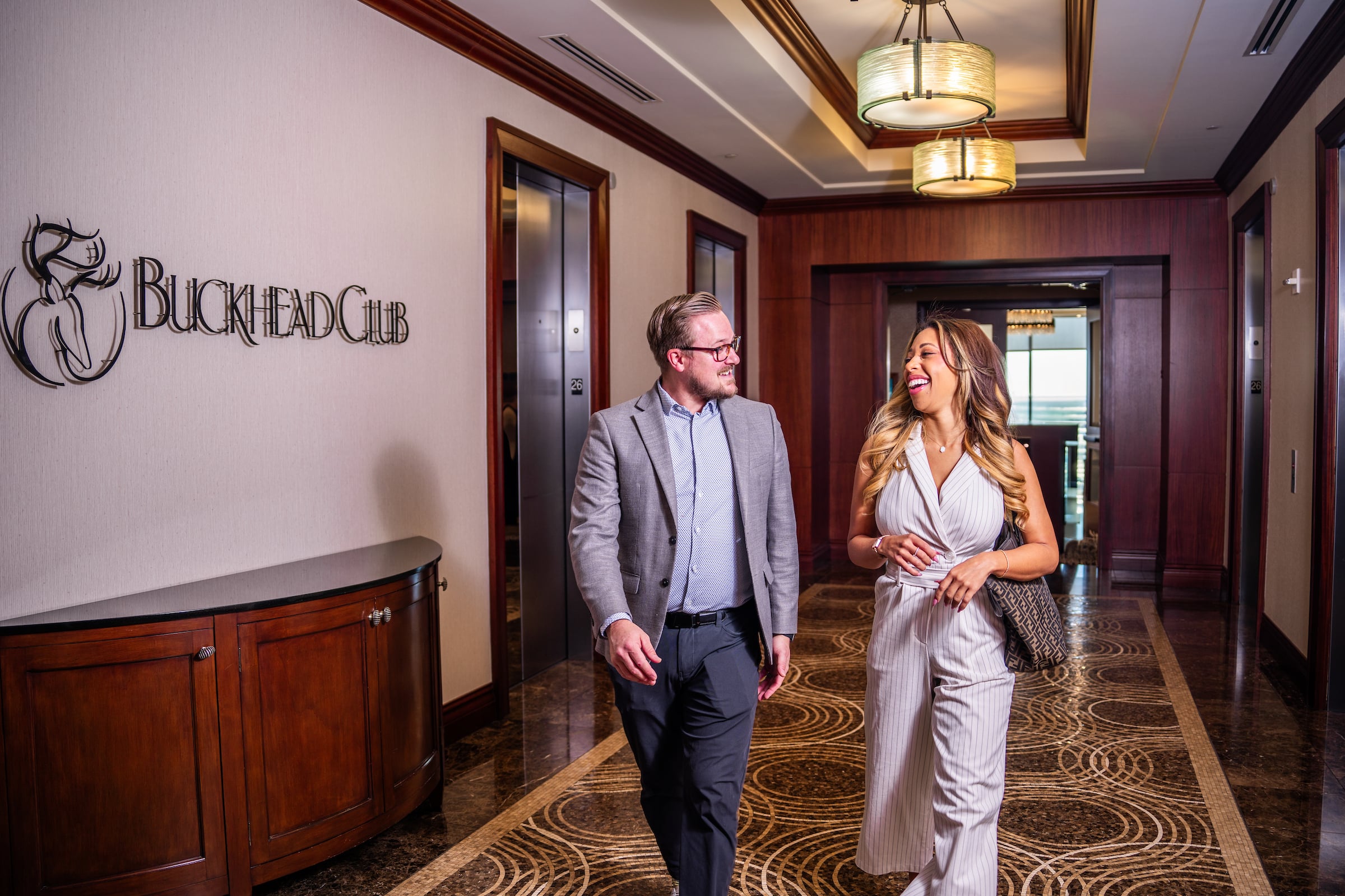 Man and Woman walking down a hallway