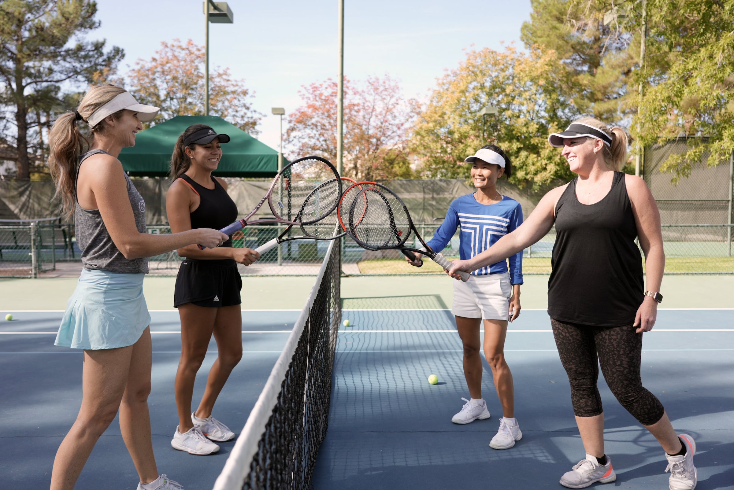 Four Women Tennis Players on court