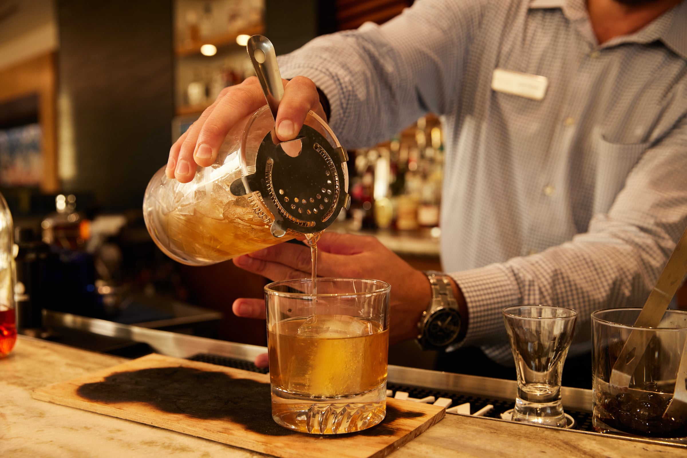 Bartender pouring a cocktail