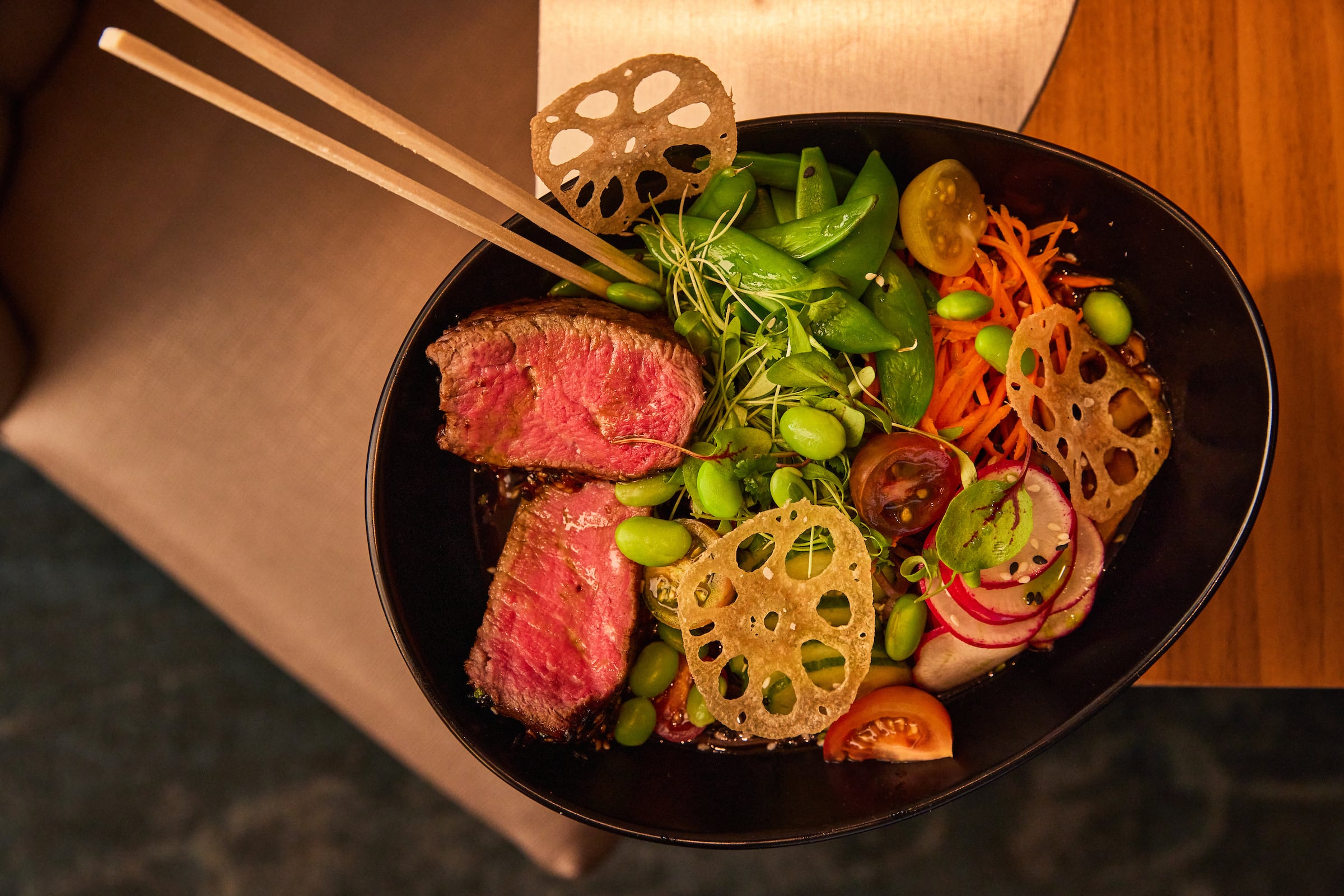 Bowl of food with chopsticks