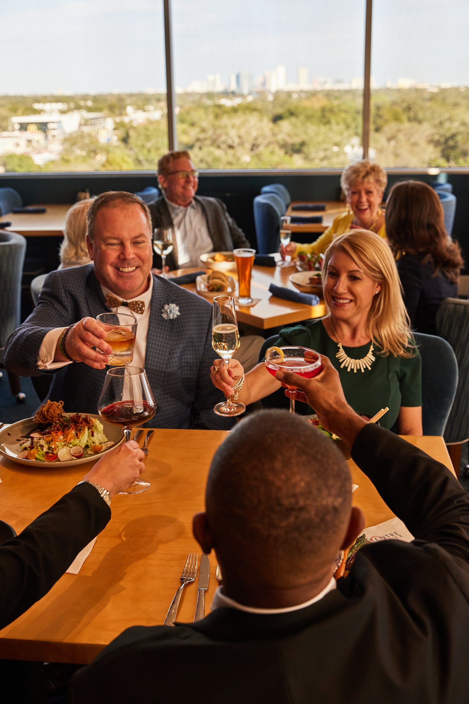 People dining and toasting at Centre Club Tampa