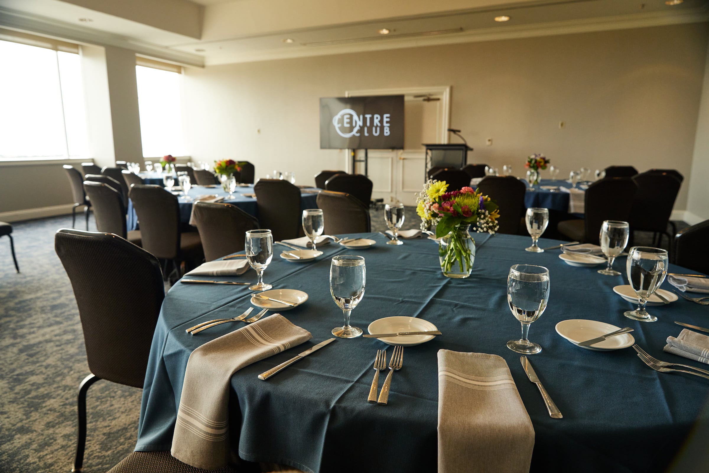 Centre Club Tampa Bayview III meeting space set up with round tables