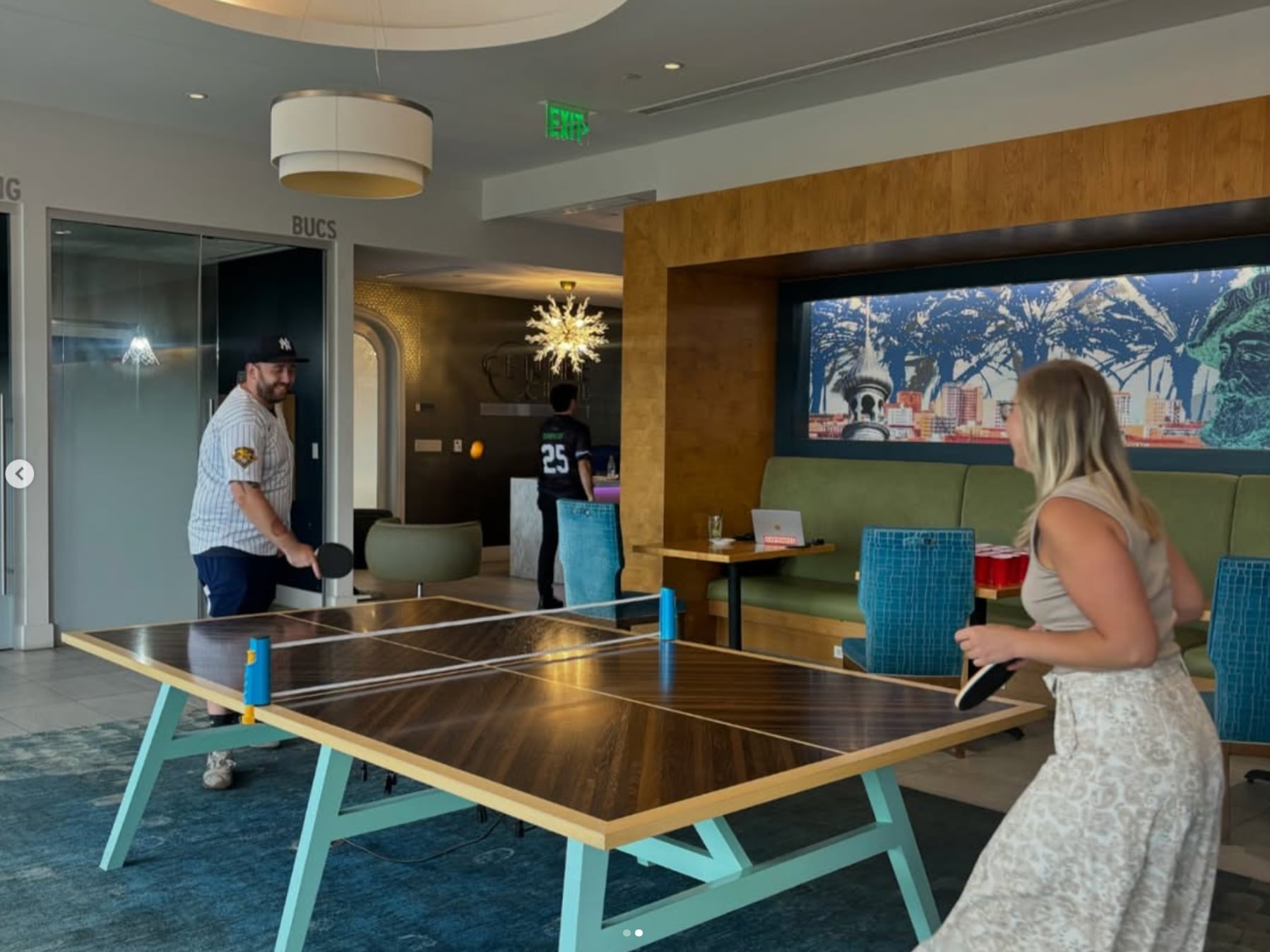 Man & Woman playing ping pong at Centre Club Tampa