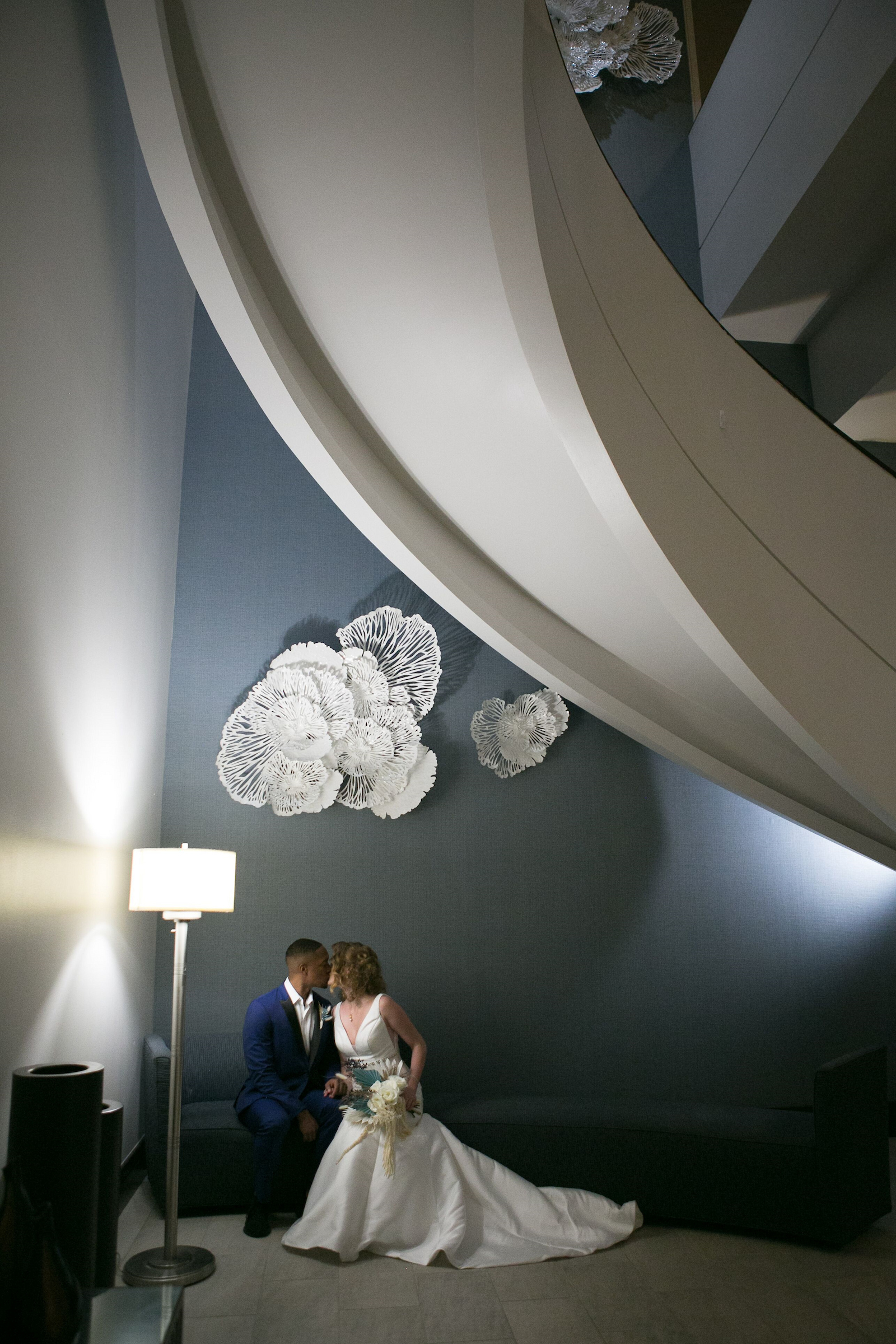 Centre Club Tampa couple posing below the grand curved staircase
