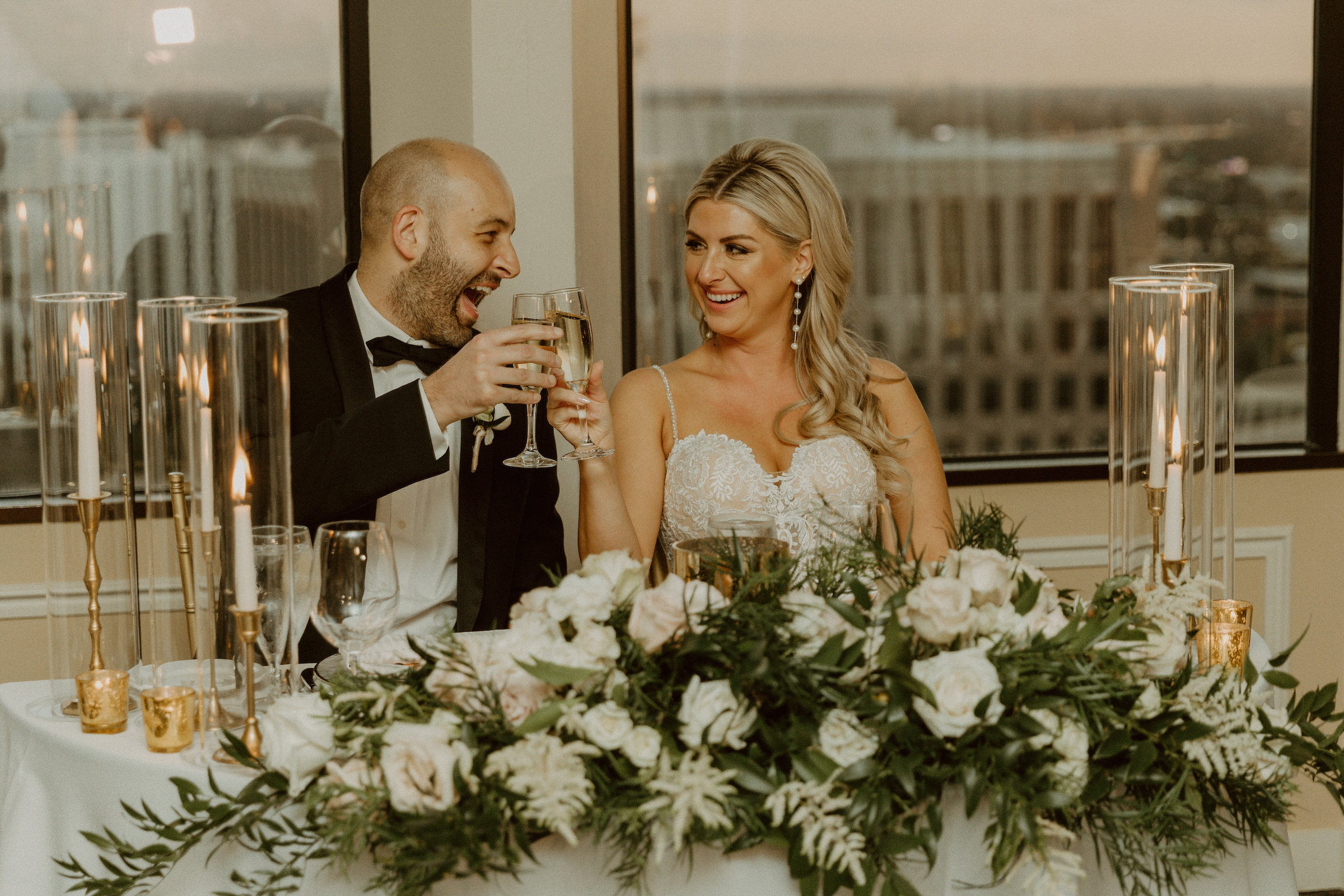 Bride & Groom toasting & smiling at each other