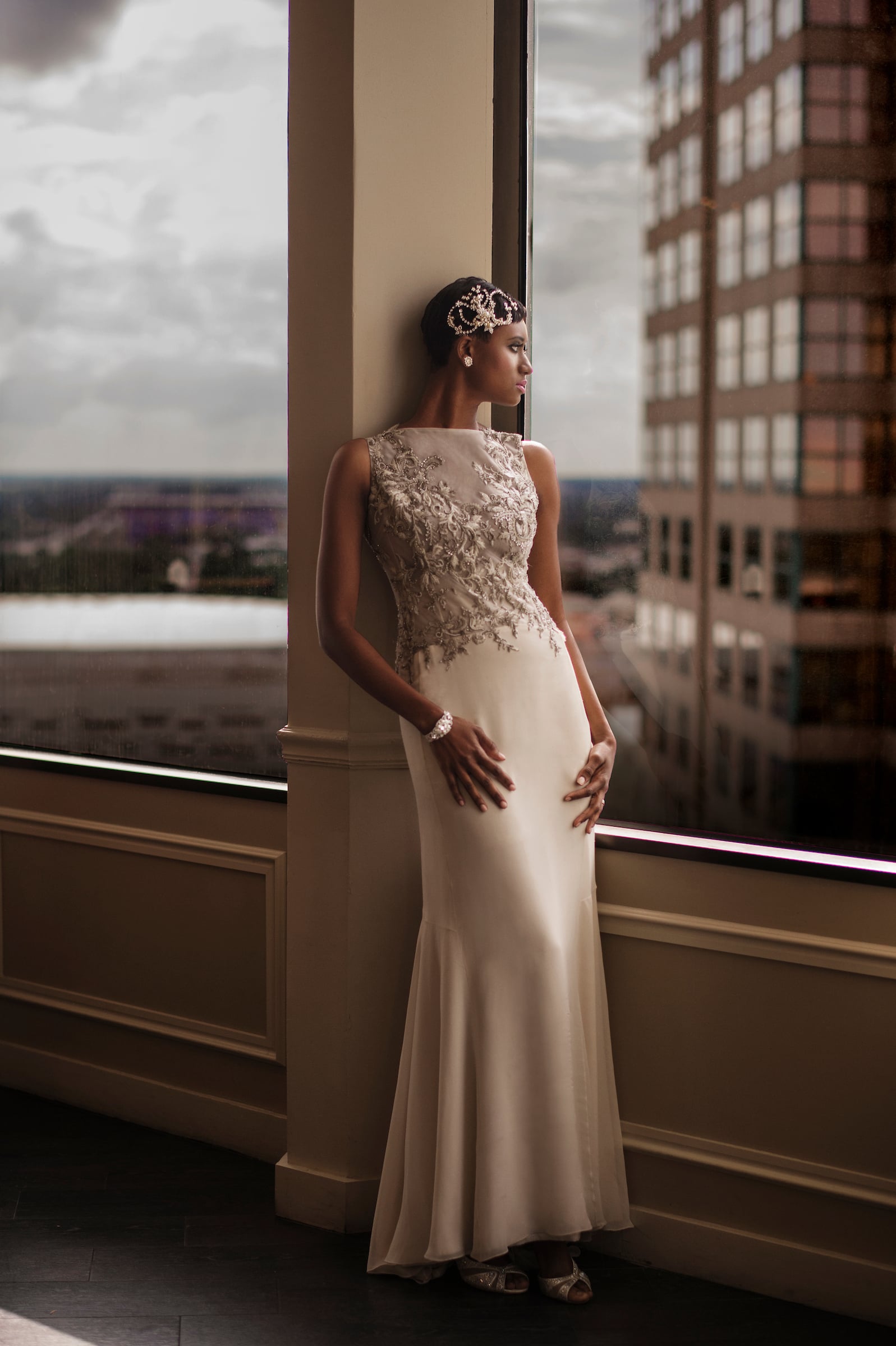 Bride posing in front of a window