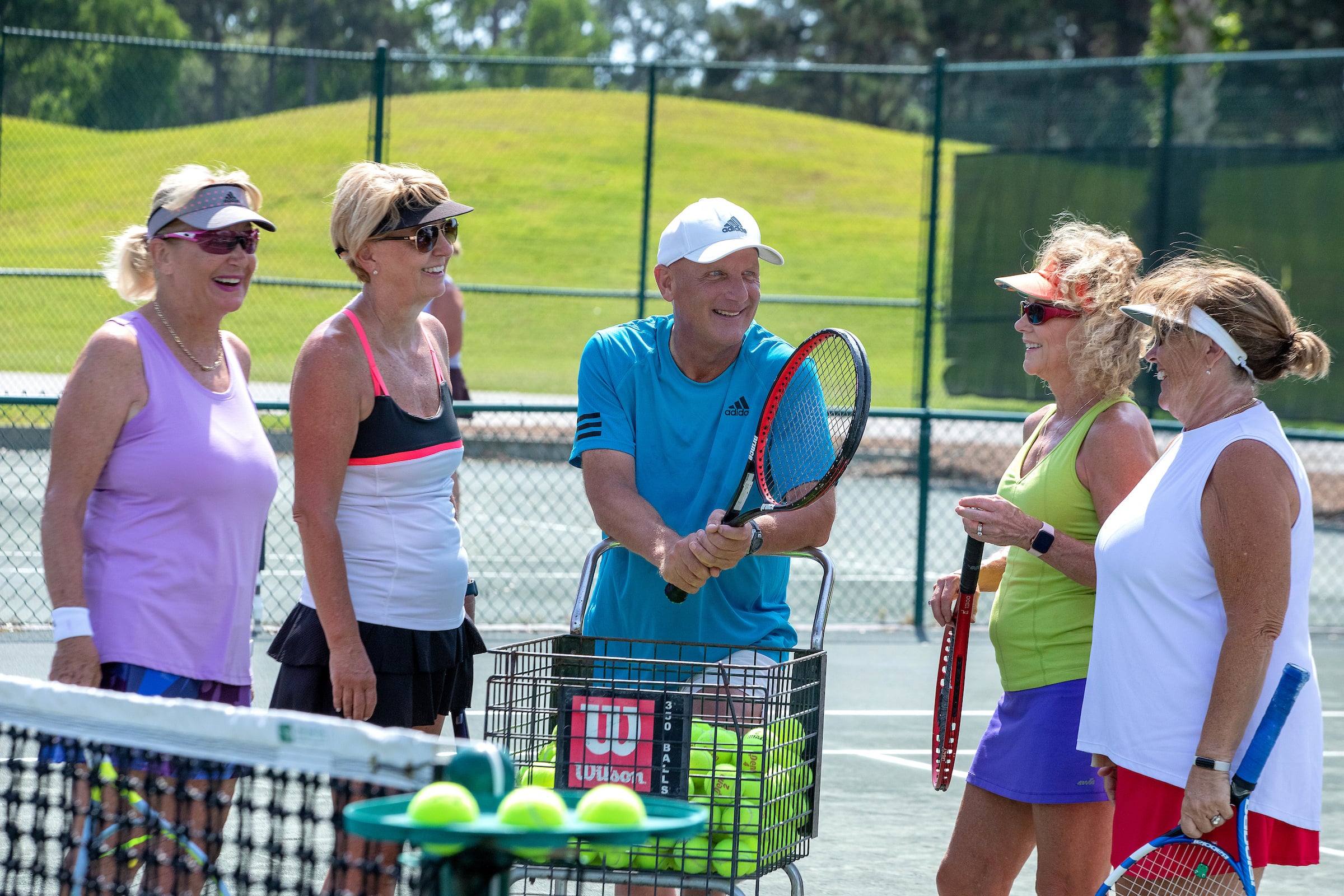 Members playing tennis