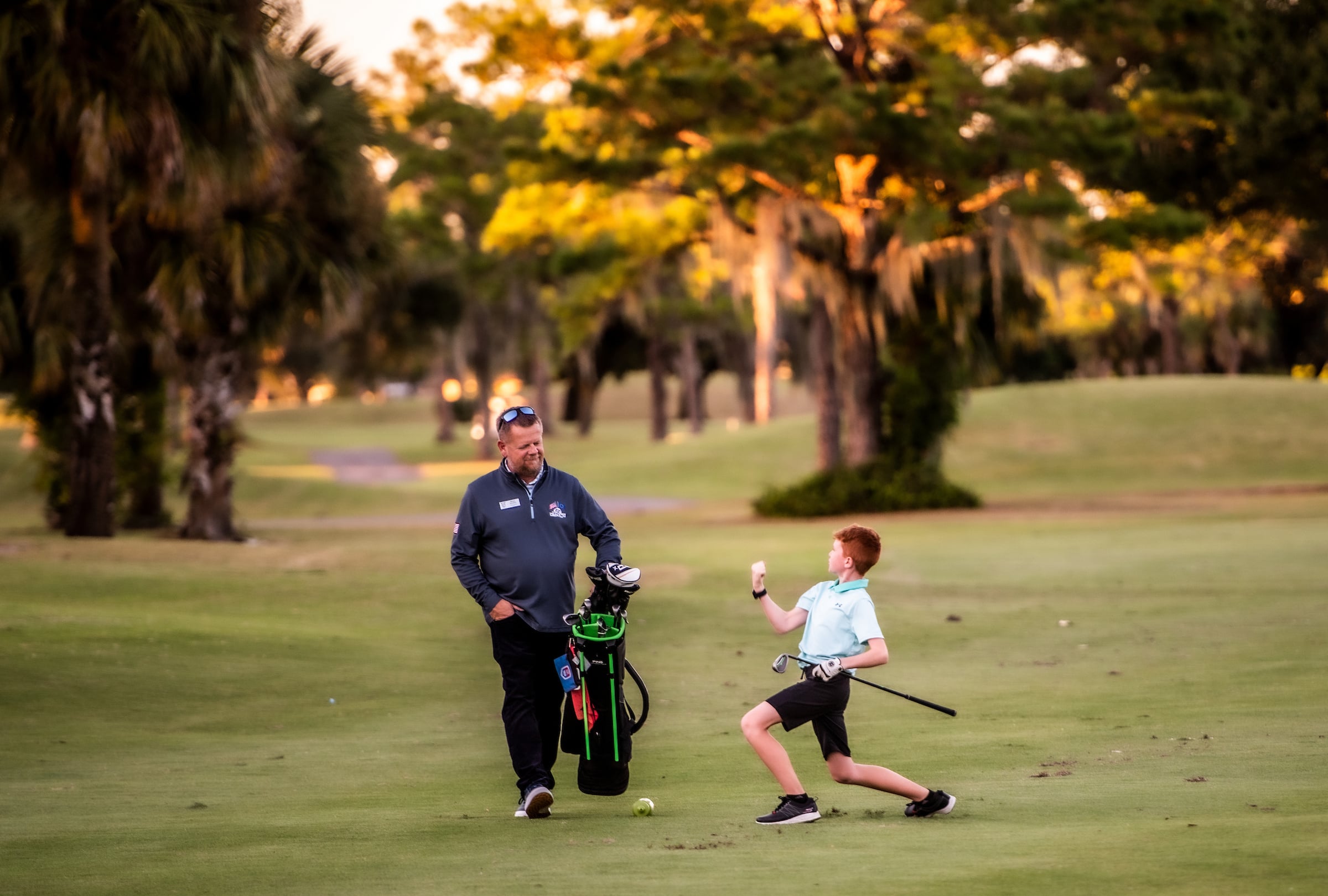 Junior golfer celebrating