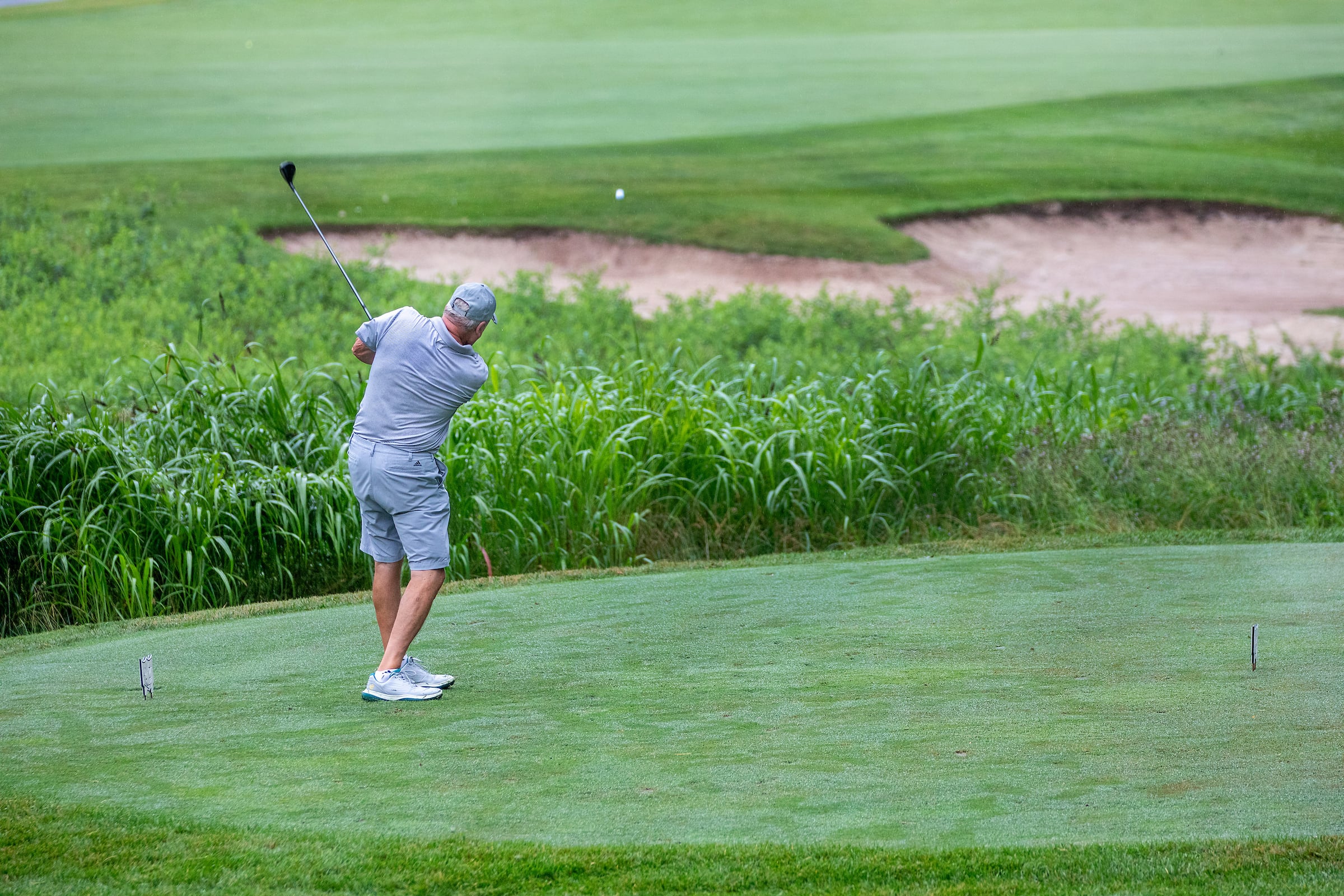 Man hitting a golf ball
