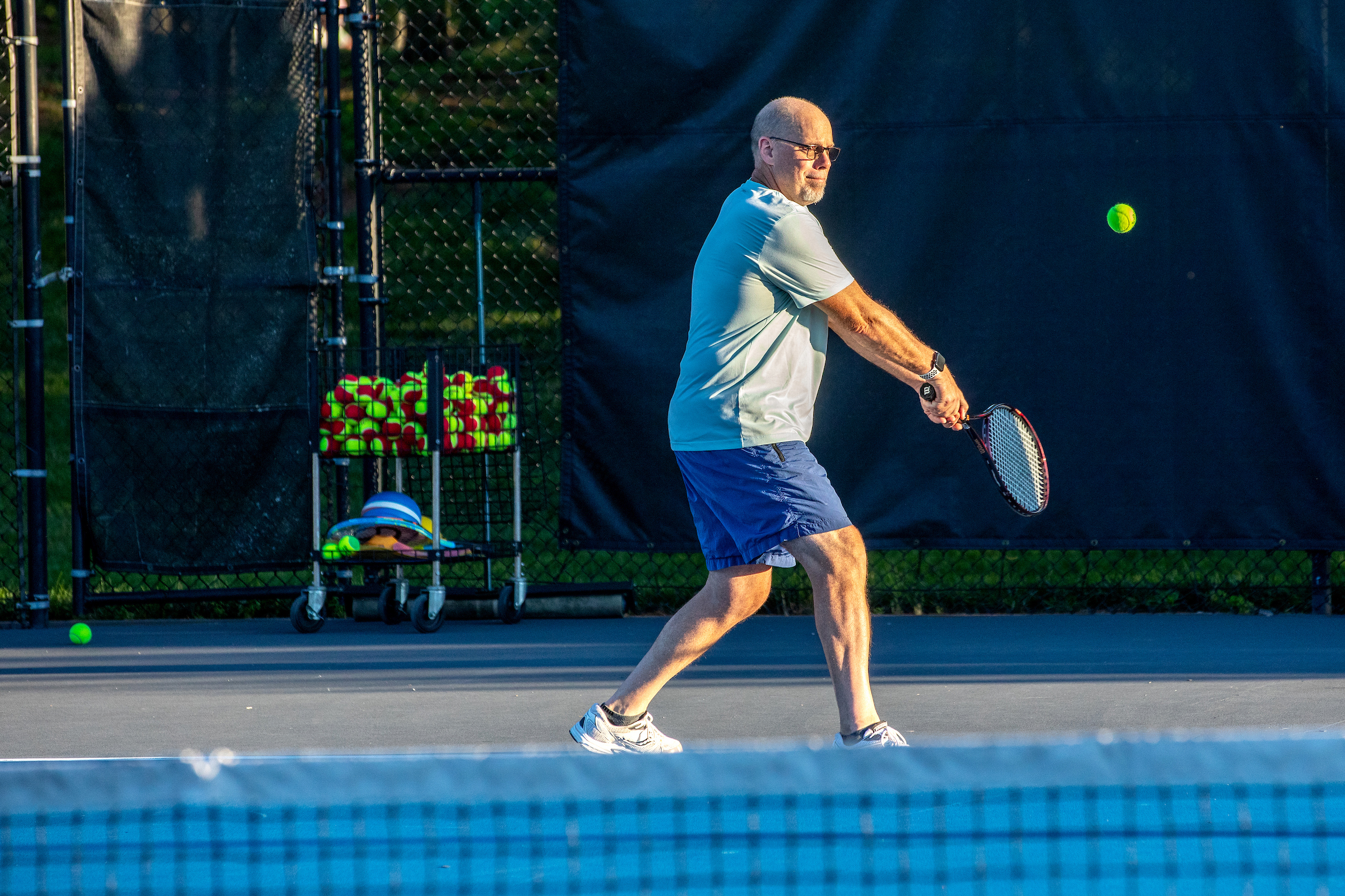 man hitting a tennis ball