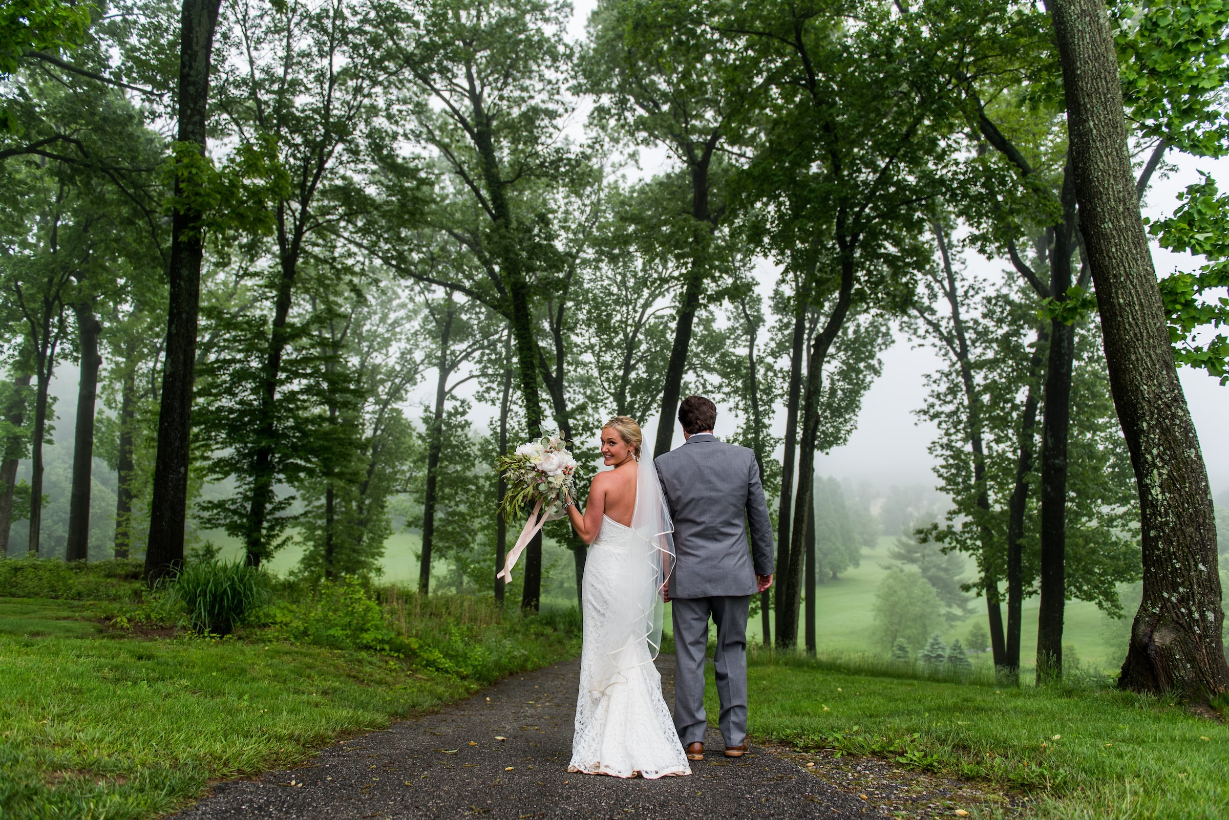 Bride and groom walking outside