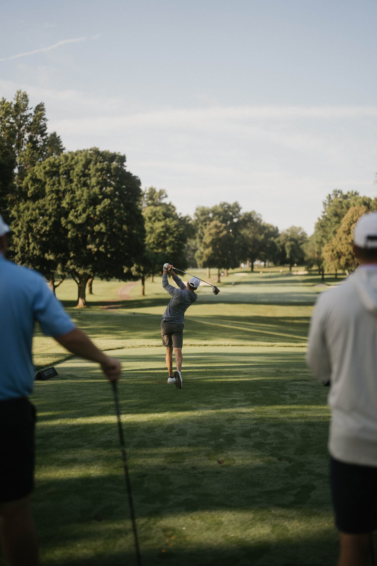 golfer swinging a club