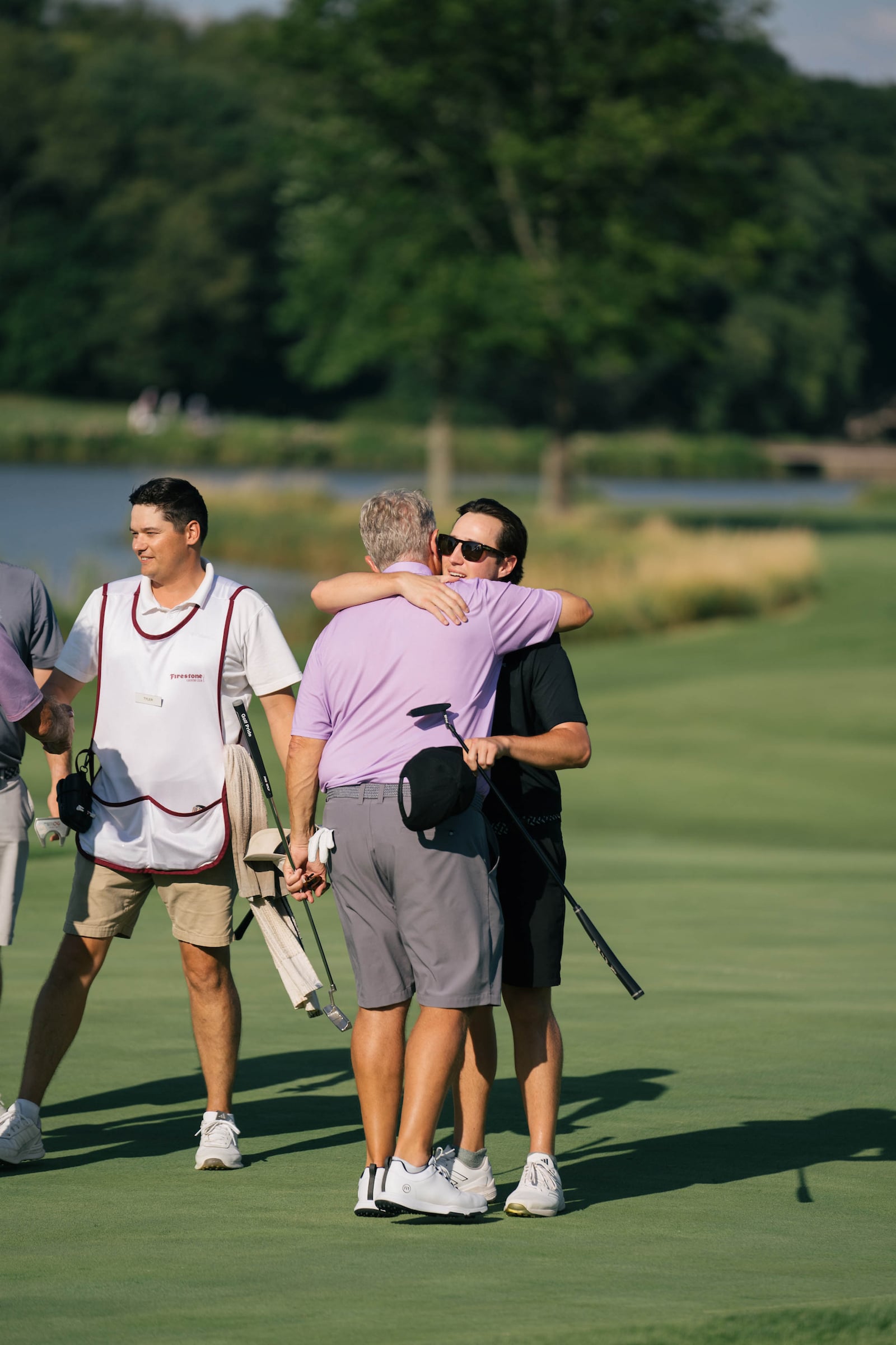Golfers hugging