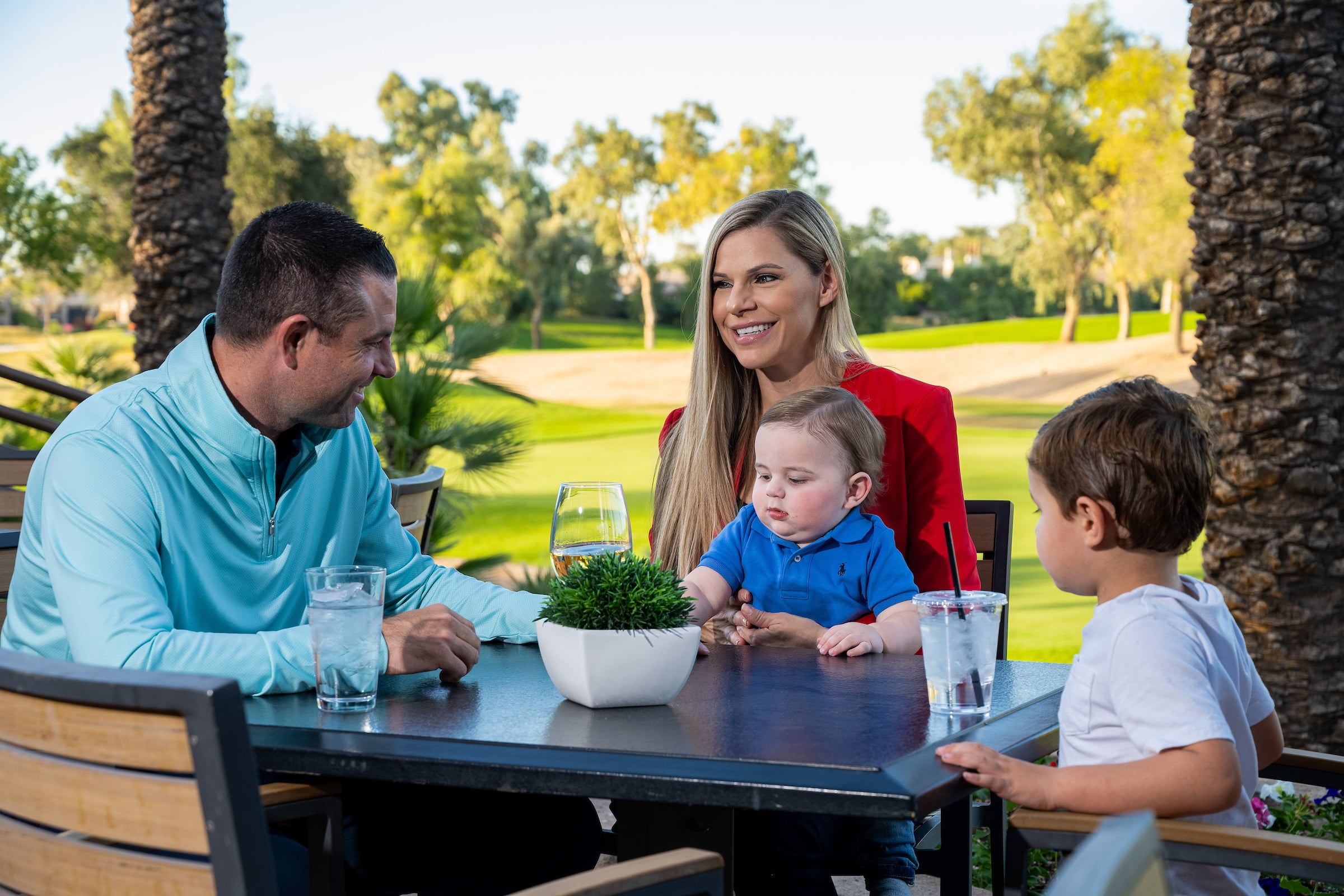 family dining on a patio