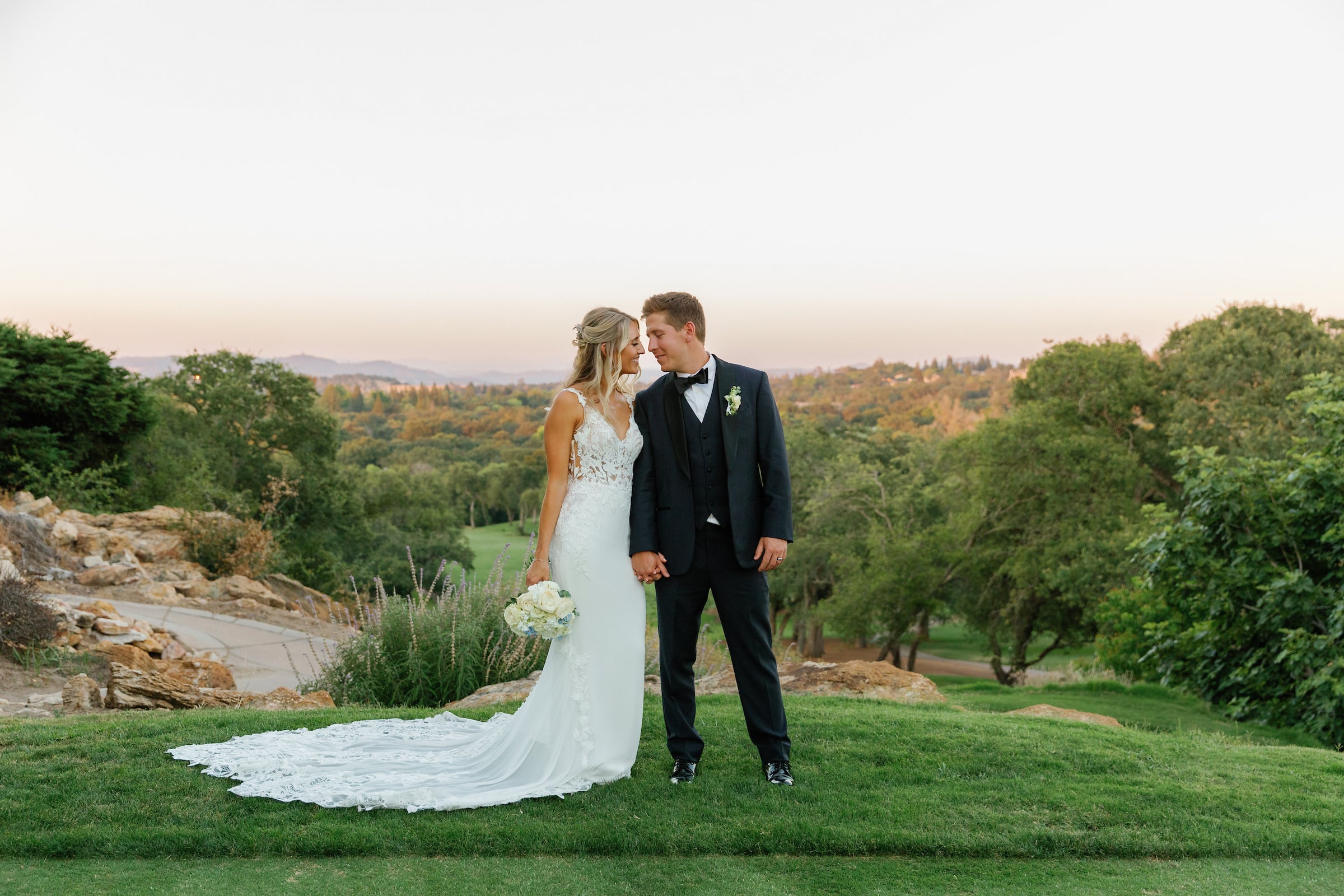 bridge and groom standing on a golf course