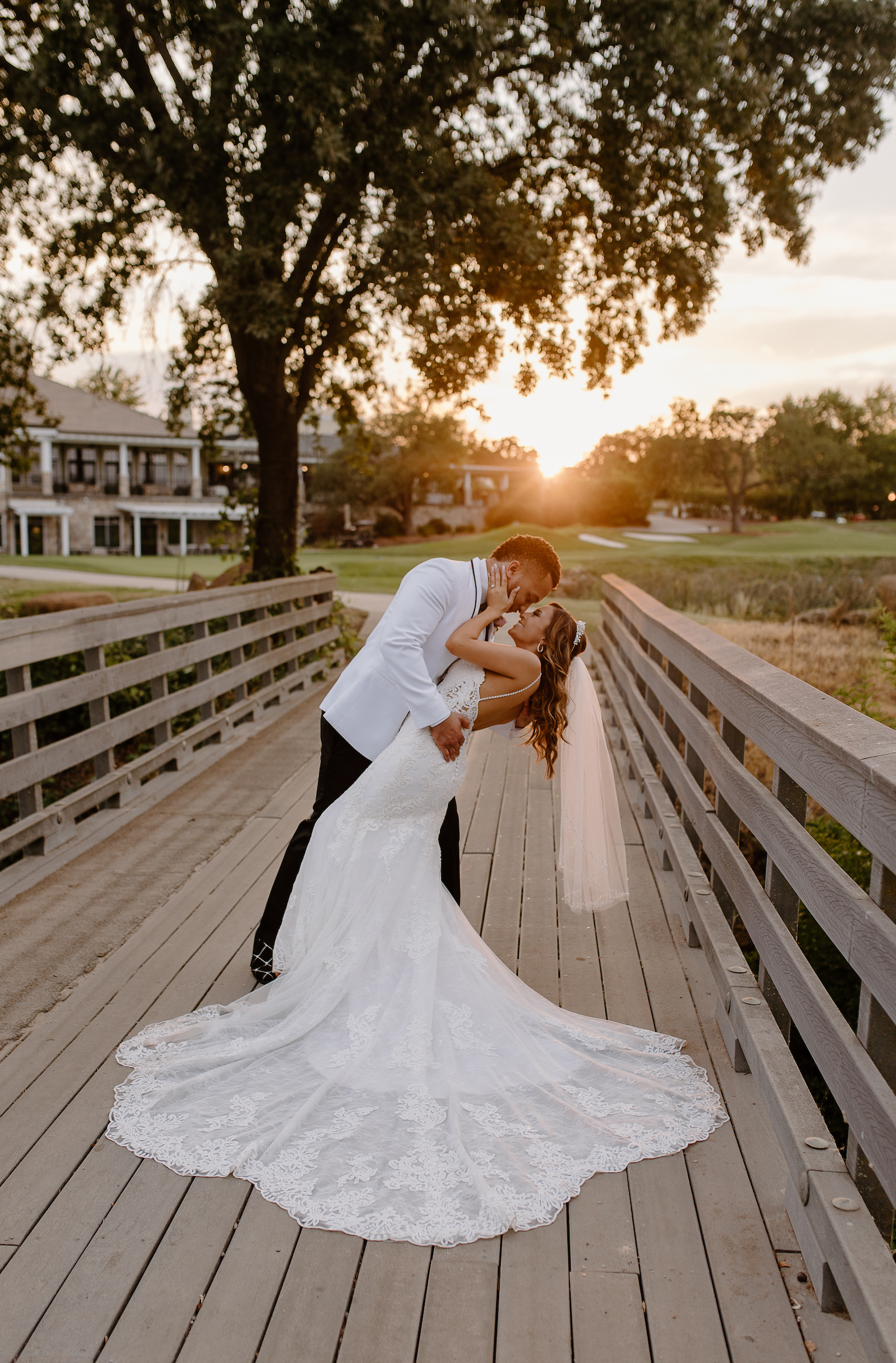 Bridge and groom kissing on bridge