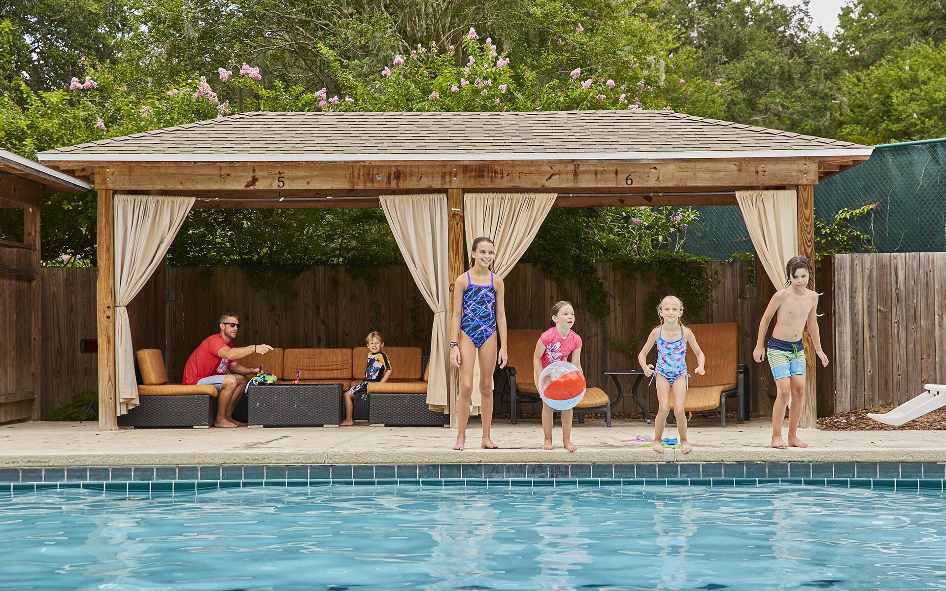 kids jumping into a pool