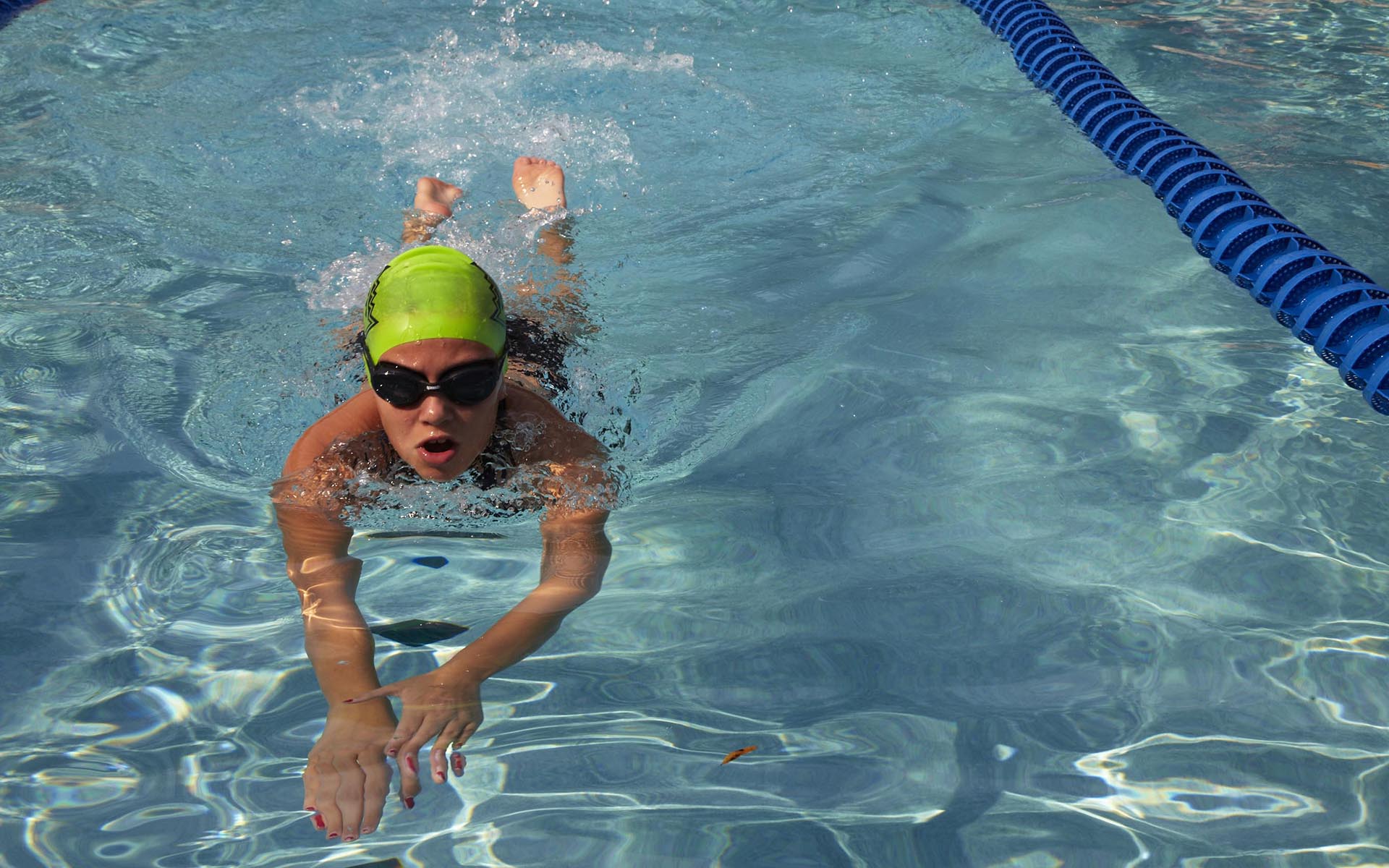 teenager swimming in a lap pool