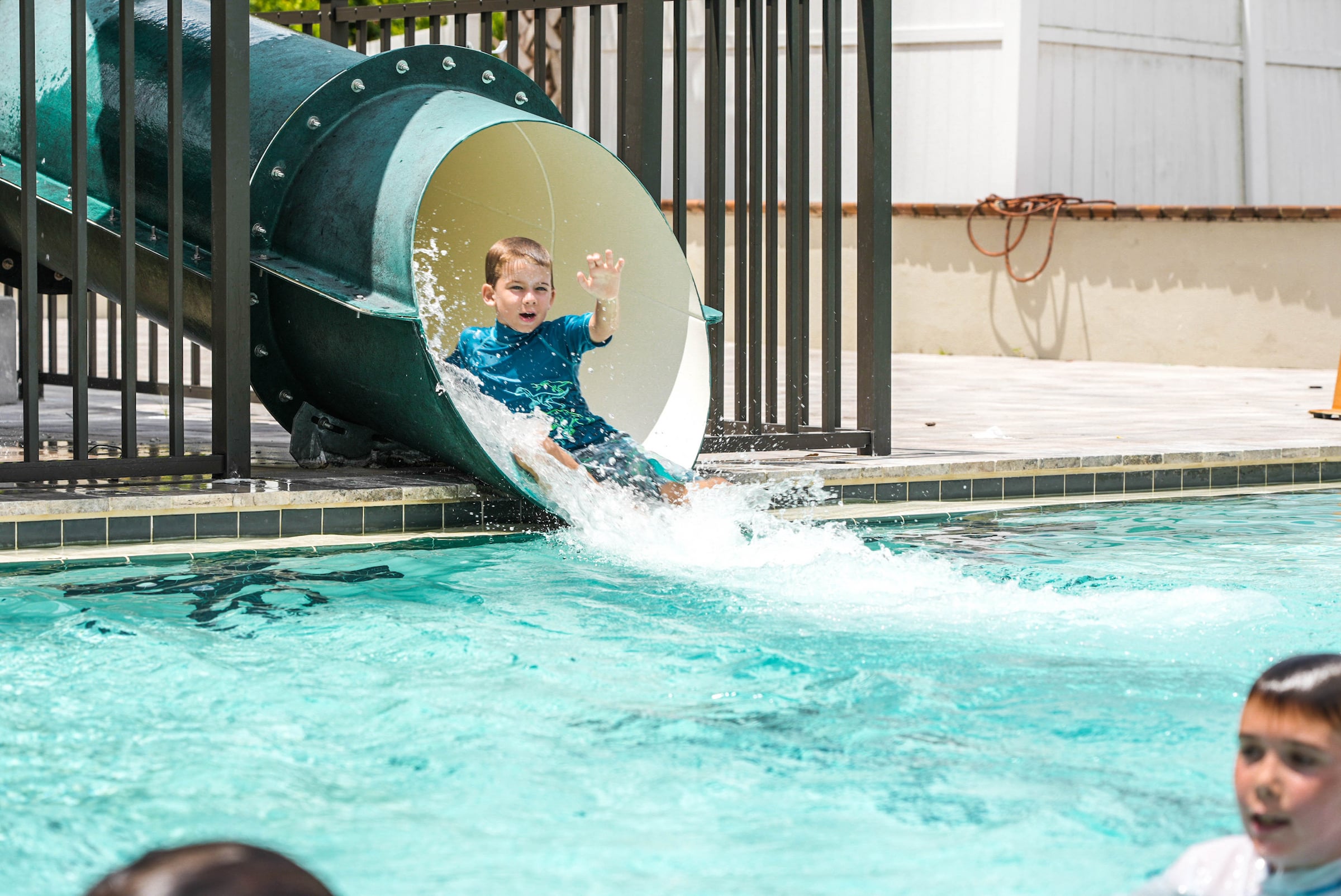 Boy sliding down a water slide
