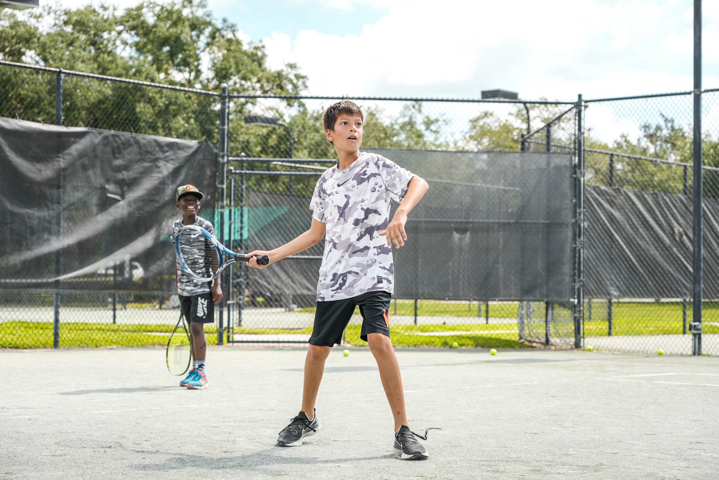 Boy playing tennis