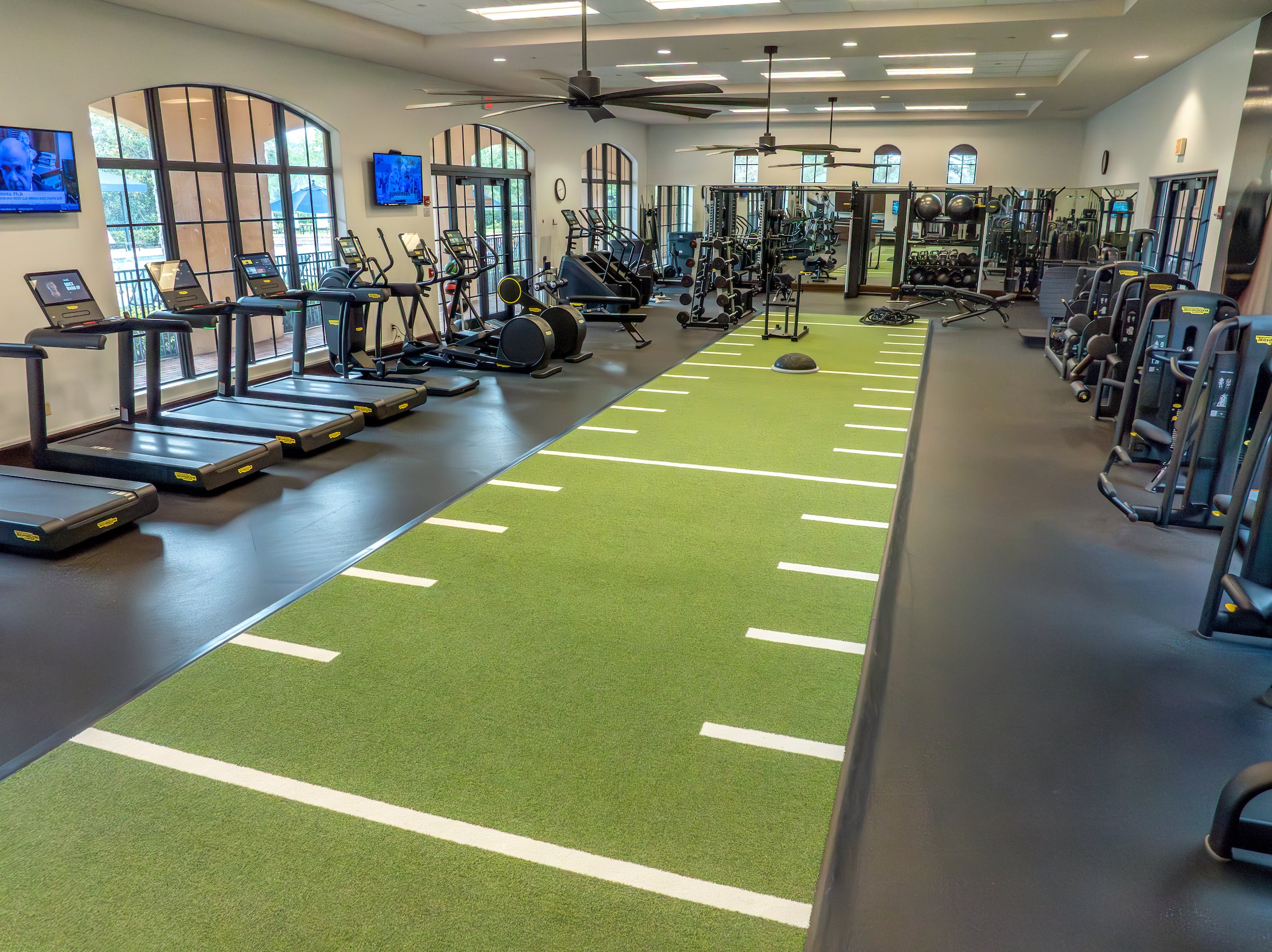 workout room with various fitness equipment