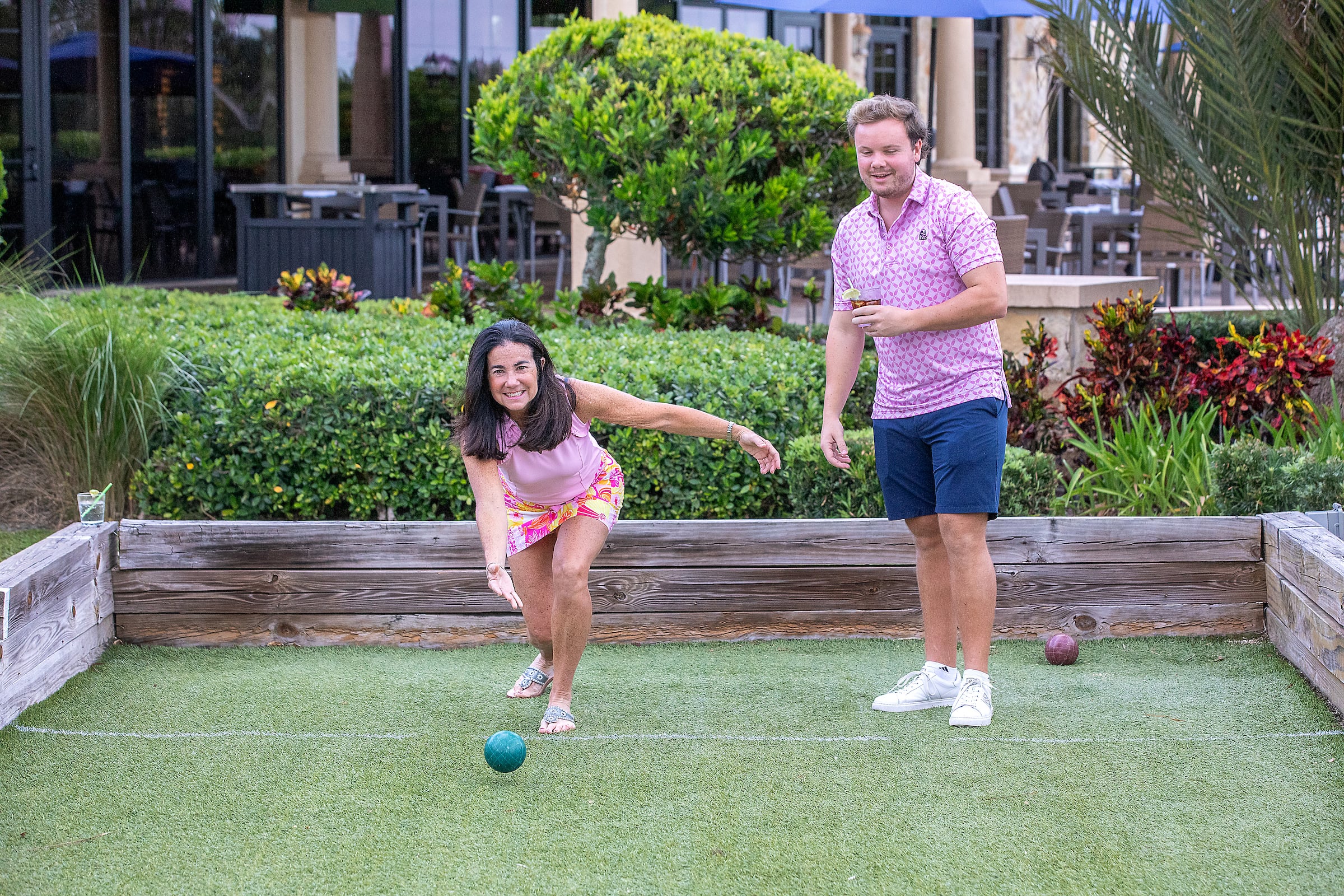 2 adults playing bocce ball