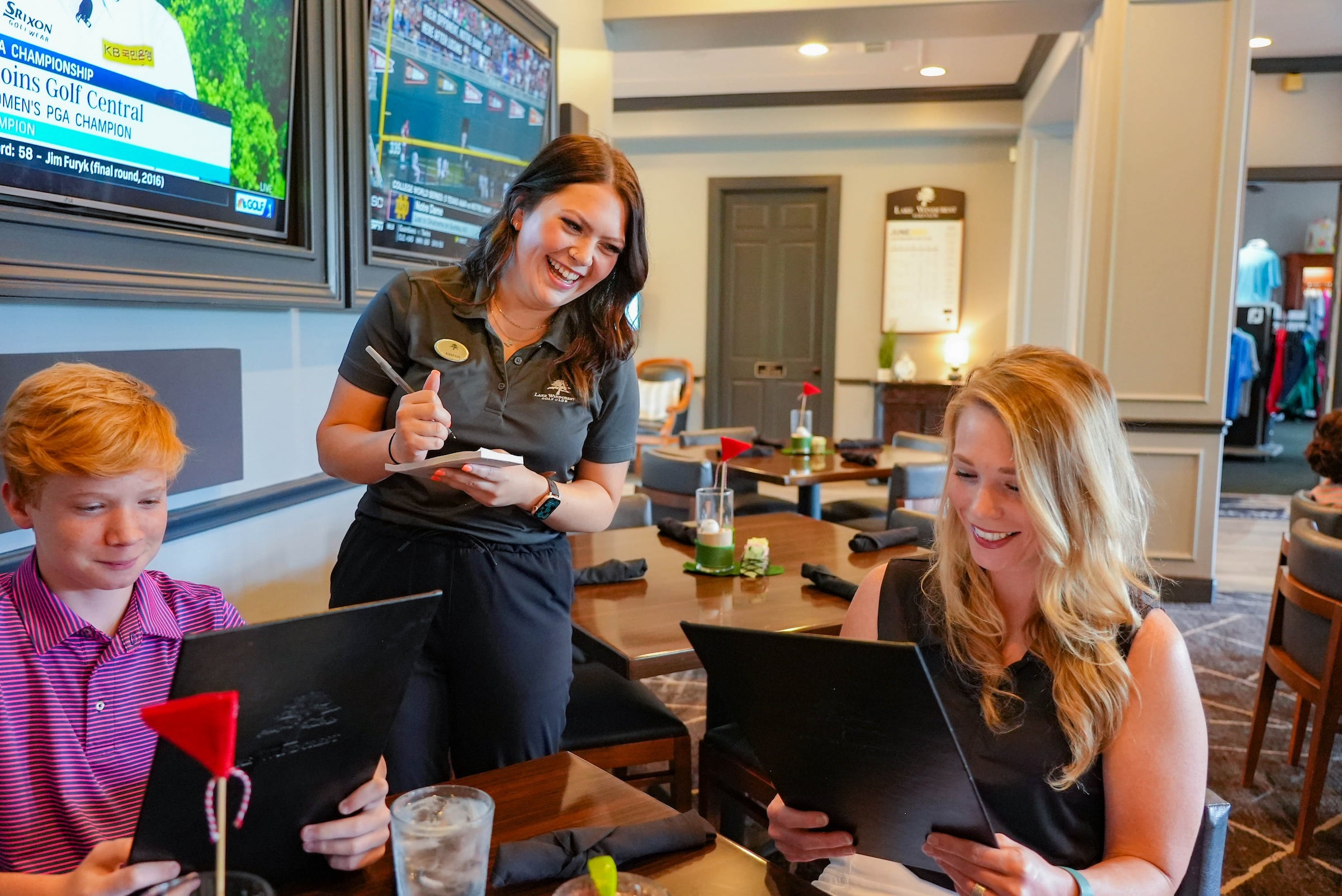members and waitress at restaurant