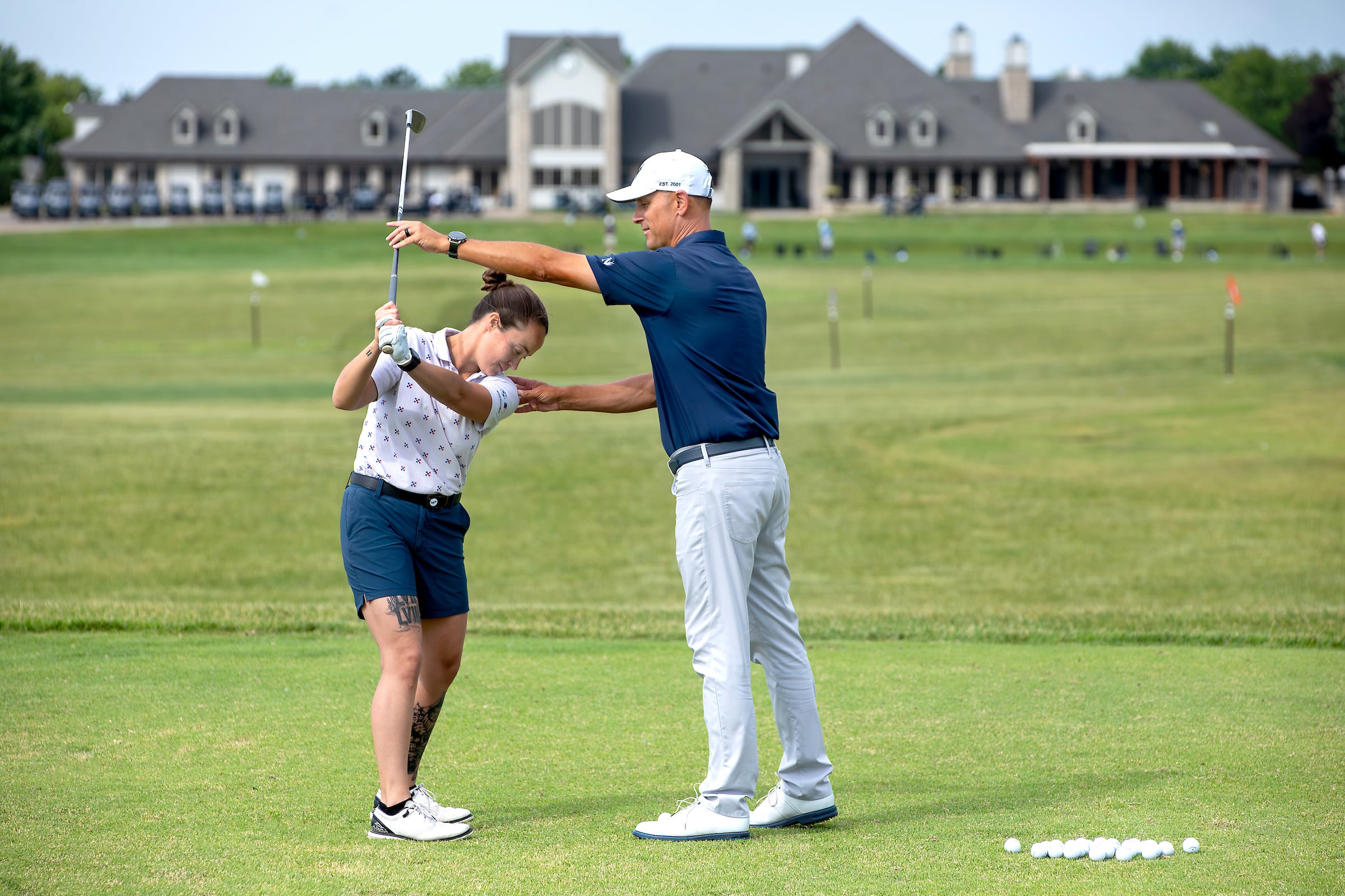 Golf instructor and student
