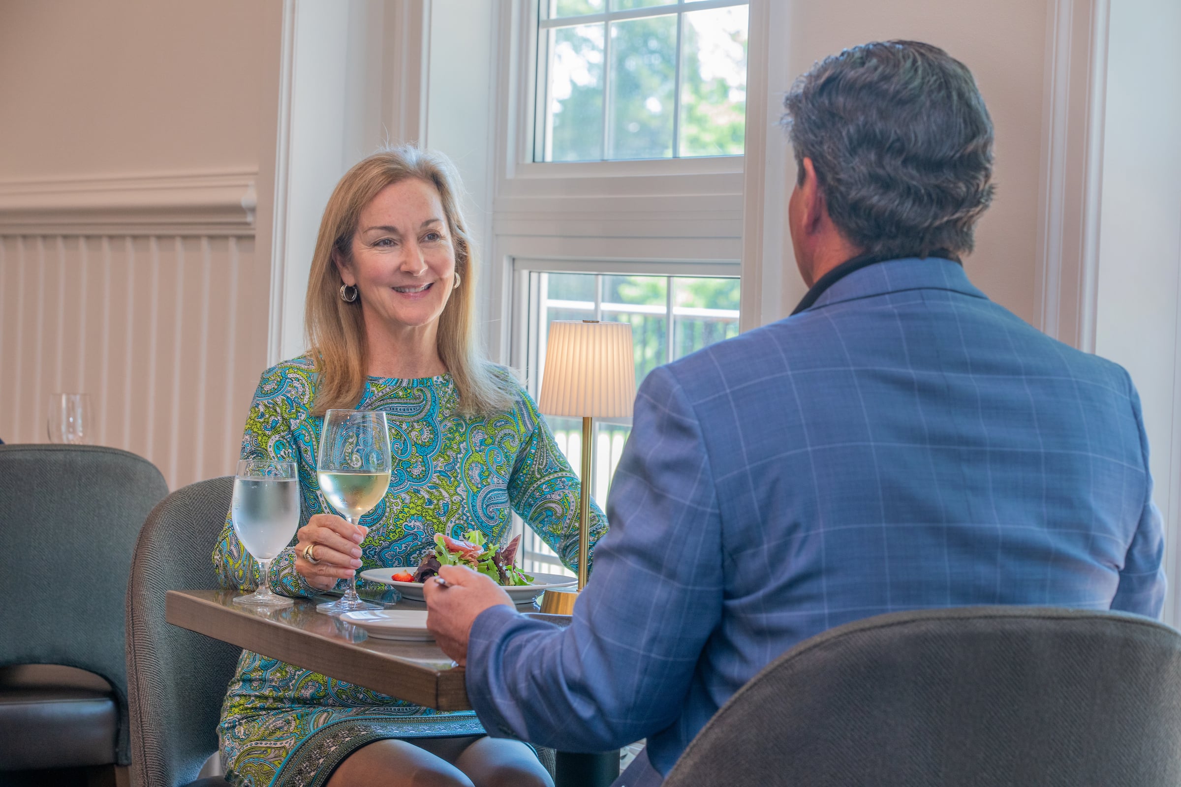 a couple talking over dinner