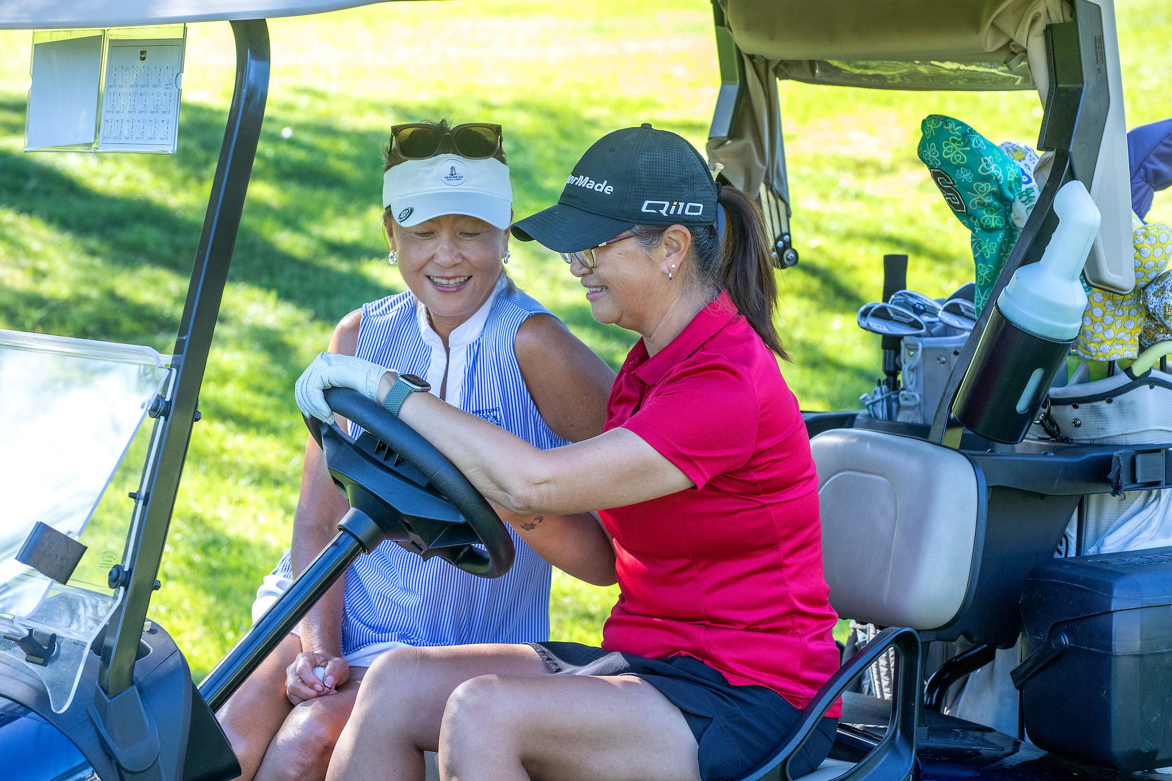 2 ladies on a golf cart
