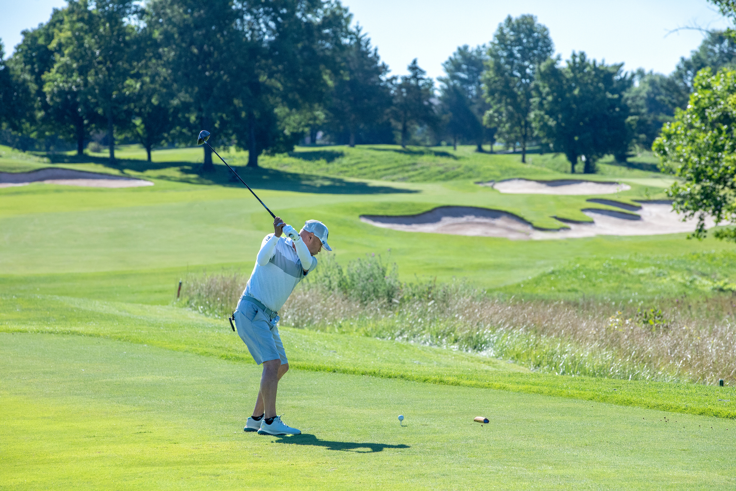 Man hitting a golf ball