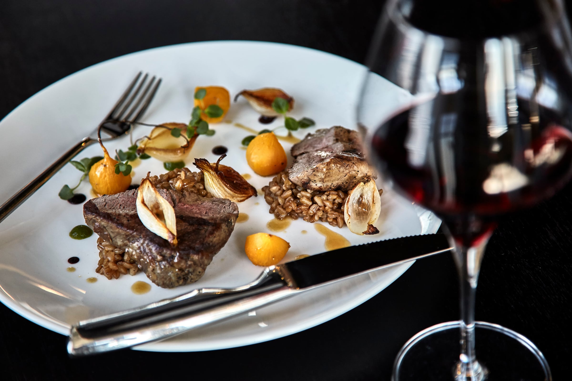 Plate of food & wine glass