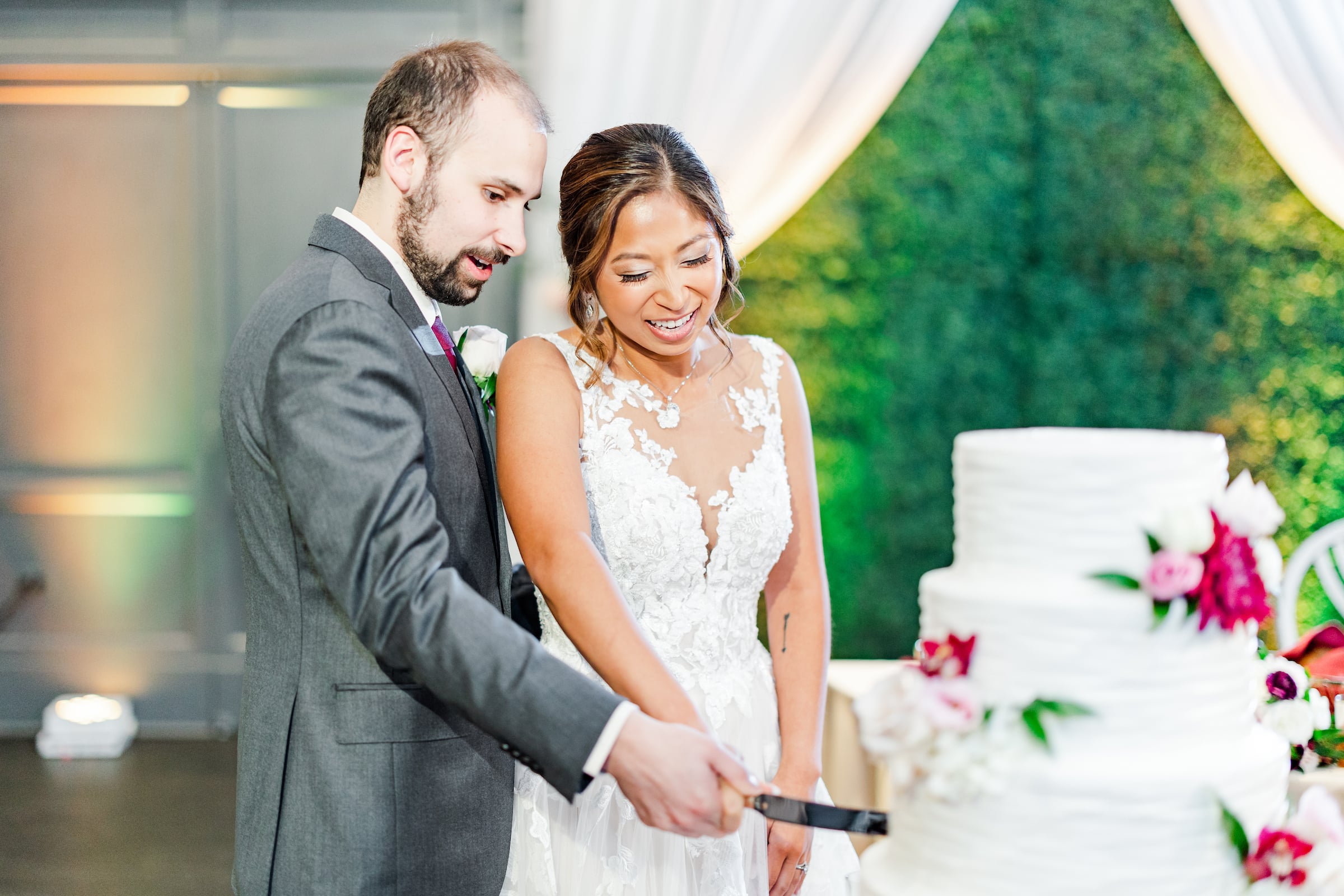 bride & groom cutting cake