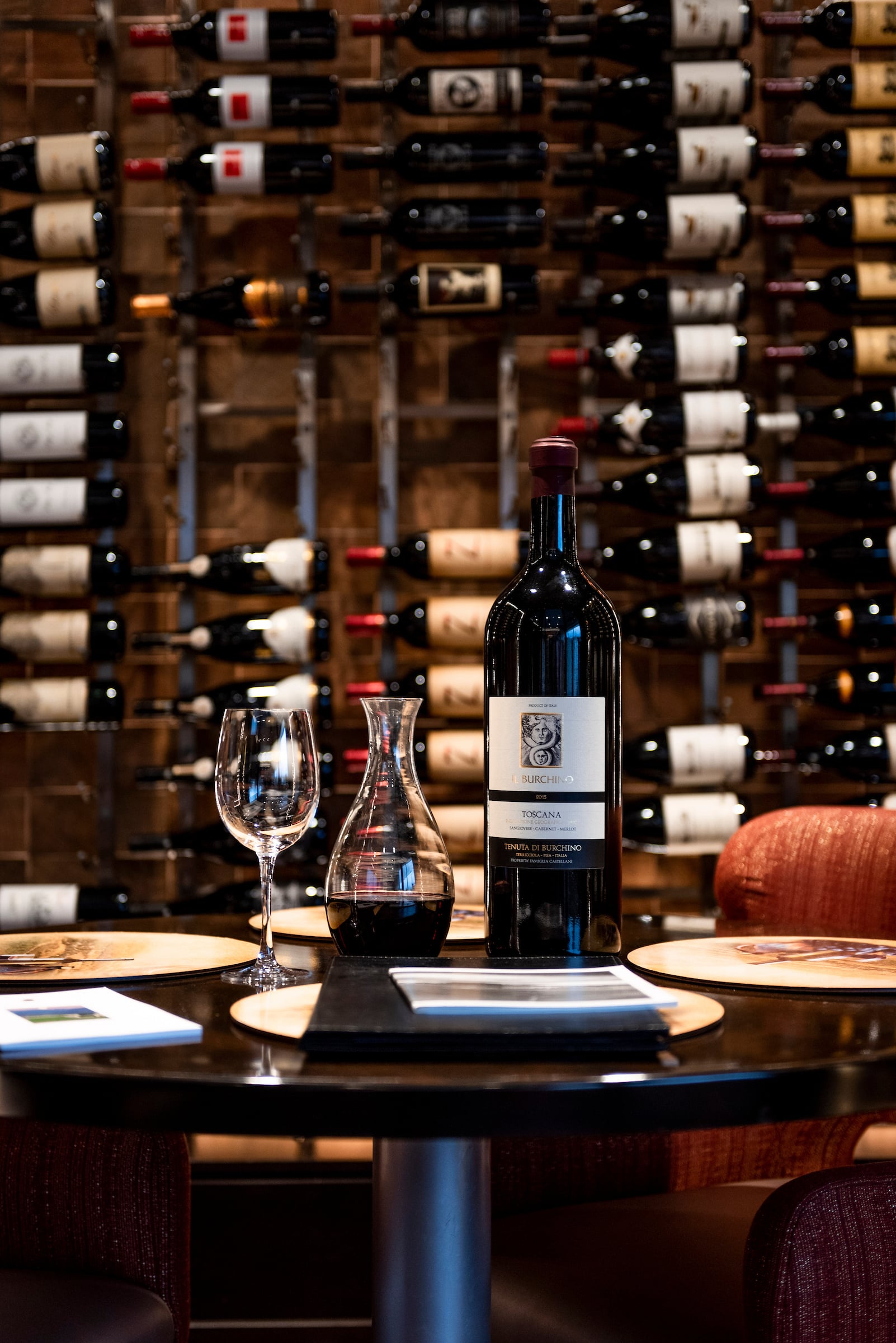 Wine bottle, wine glass, wine carafe in Rivers Club Wine Cellar