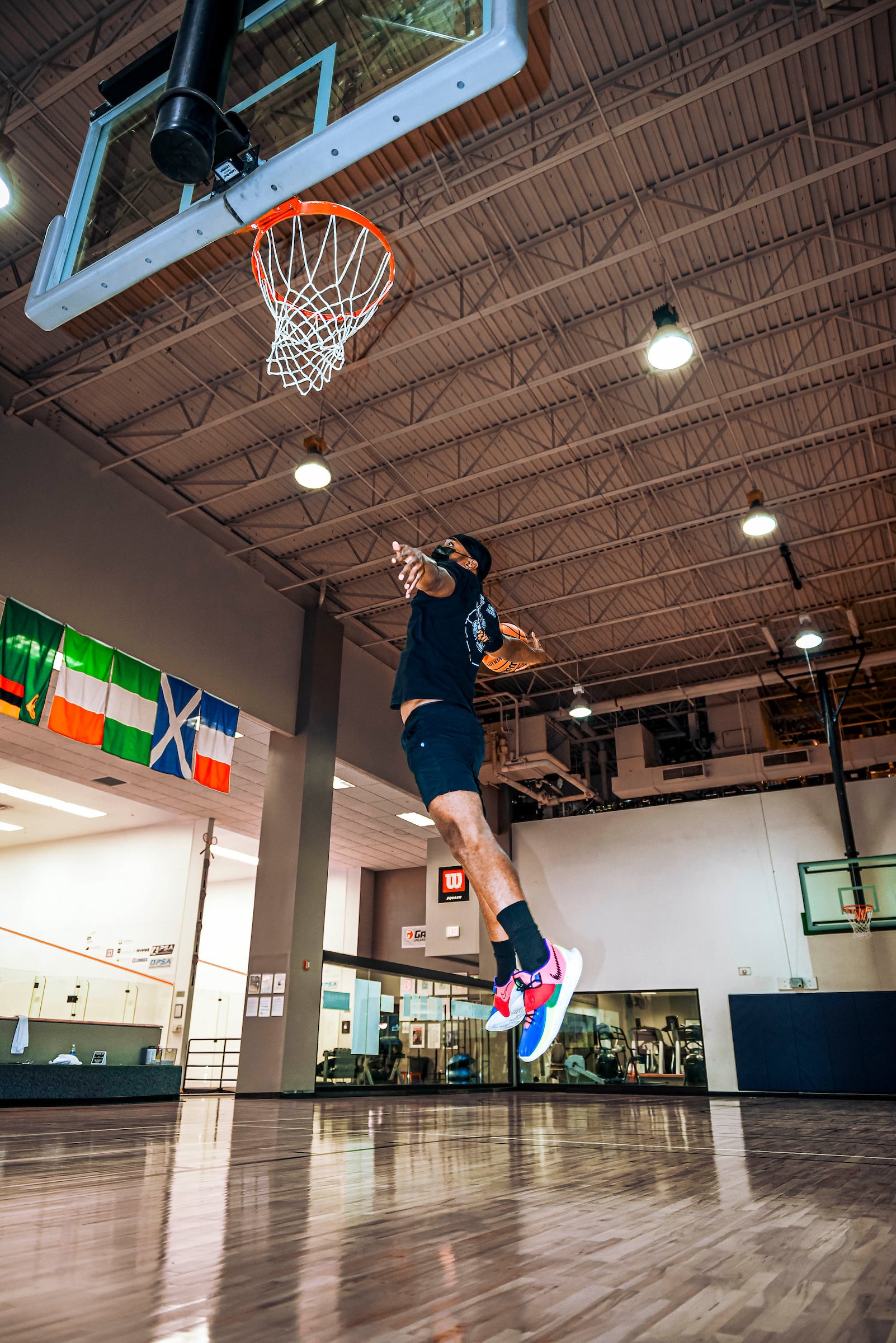 Basketball player jumping to dunk the ball