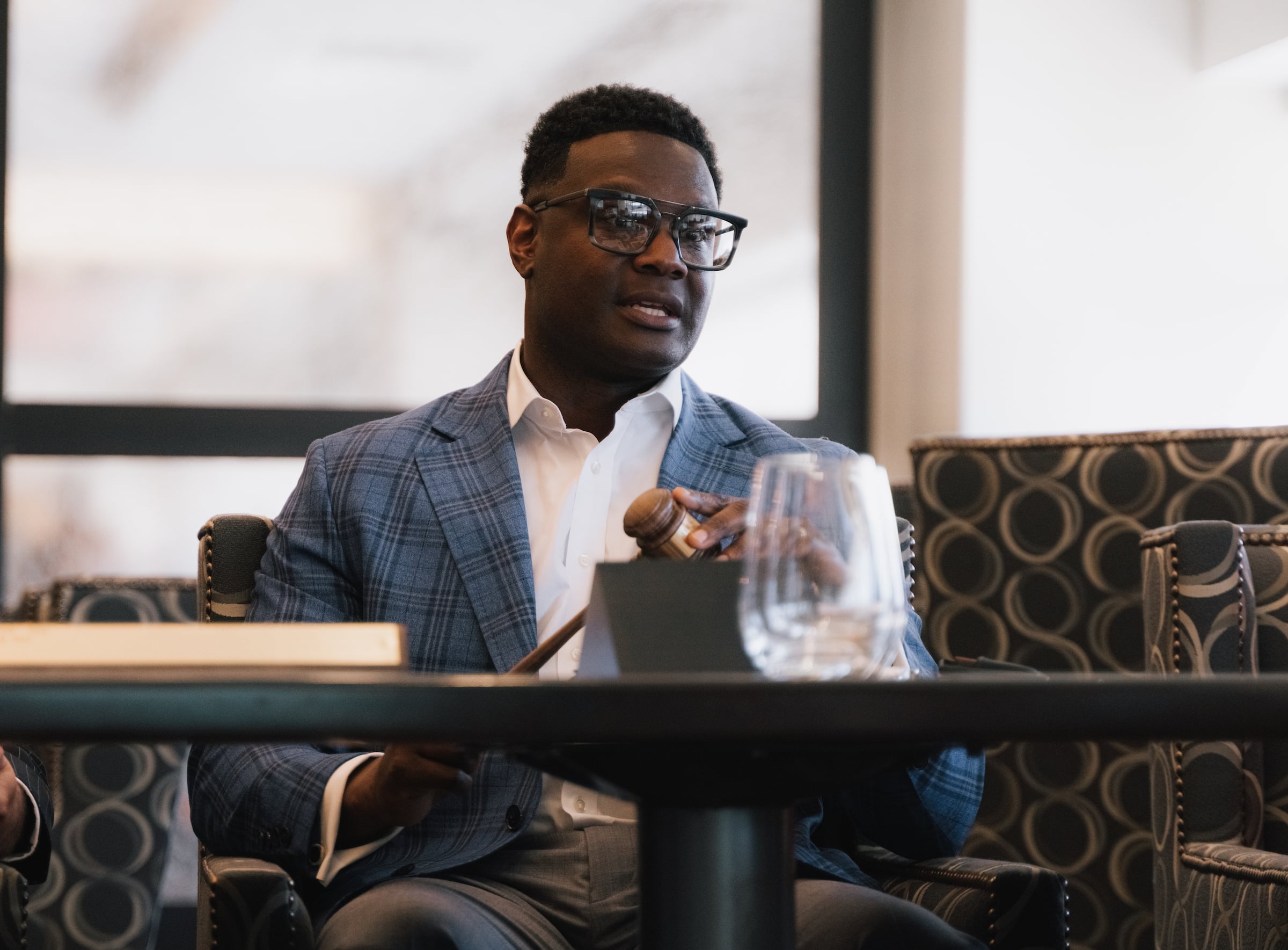Man seated at a meeting table